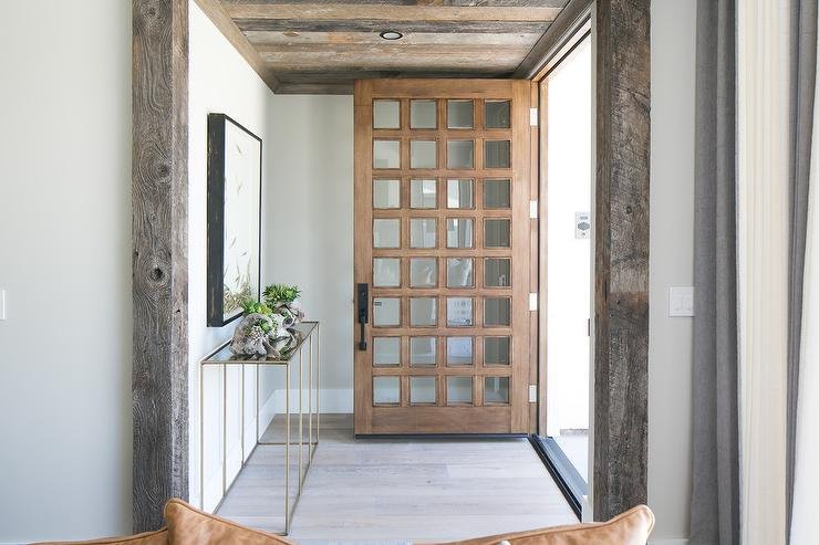 multi-paneled-glass-front-door-plank-foyer-ceiling.jpg