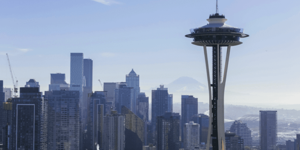 Skyline of Seattle with the Space Needle in the foreground and Seattle skyscrapers in the background.