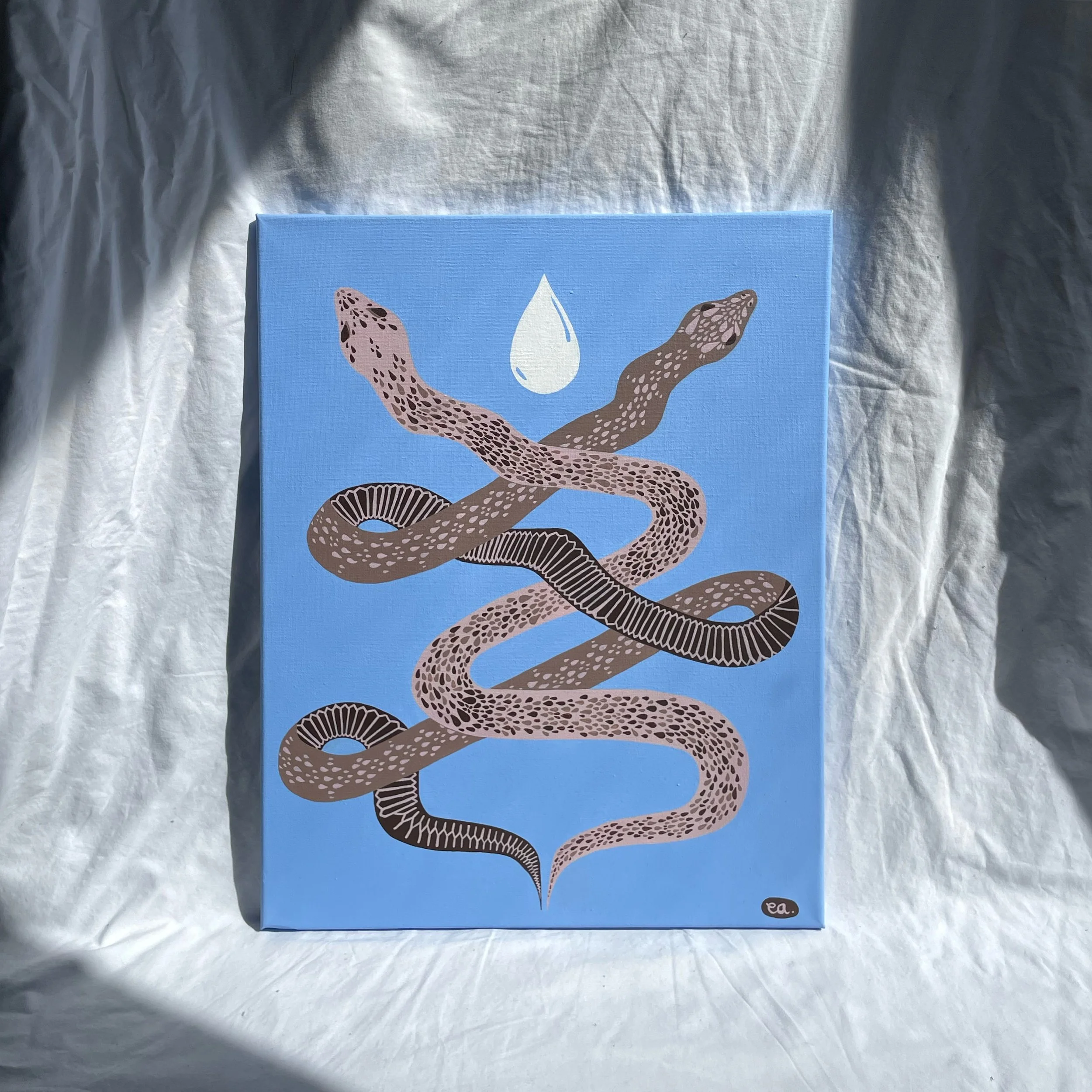 A painted illustration of a snake coiled with a water droplet above it on a blue background.