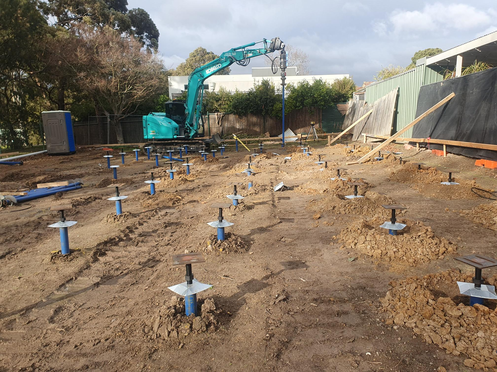 Koble Constructions 80 KN screw piles for raised floor. New build in Mitcham