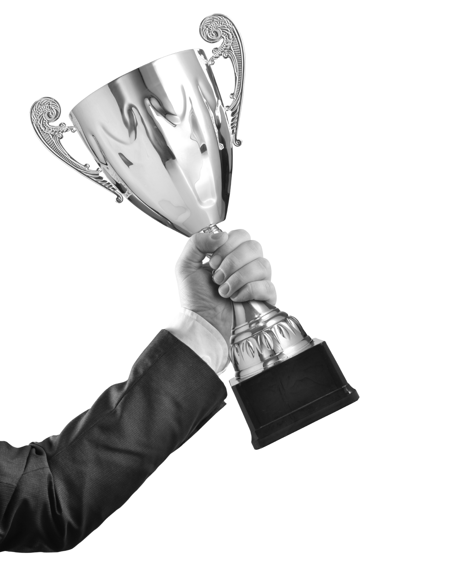 Person in a suit holding a silver trophy cup with ornate handles.