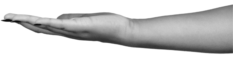 A black and white photo of an outstretched human hand and arm with the palm facing down.