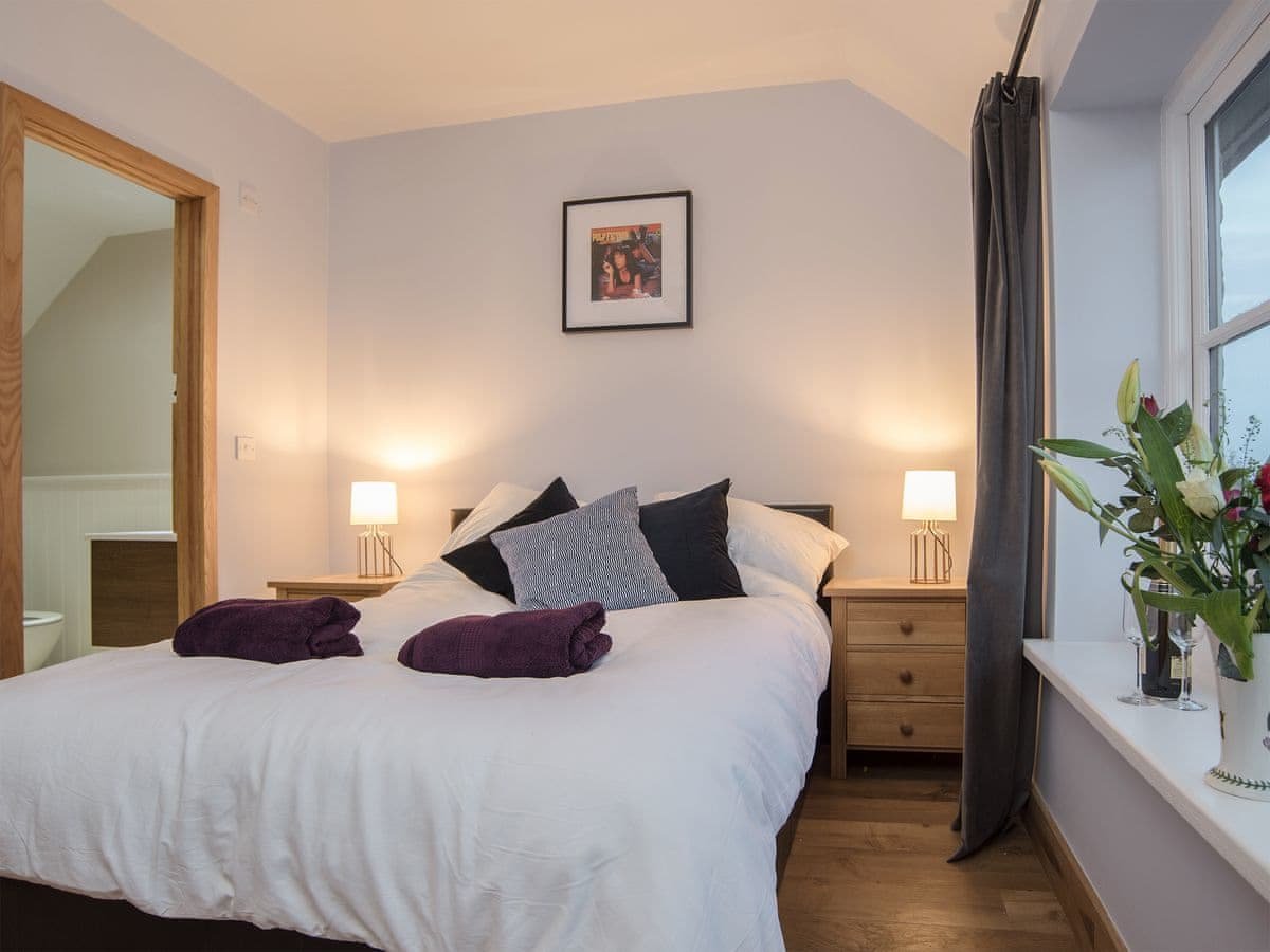 Second bedroom with double bed and en-suite shower / toilet part of the holiday cottage.
