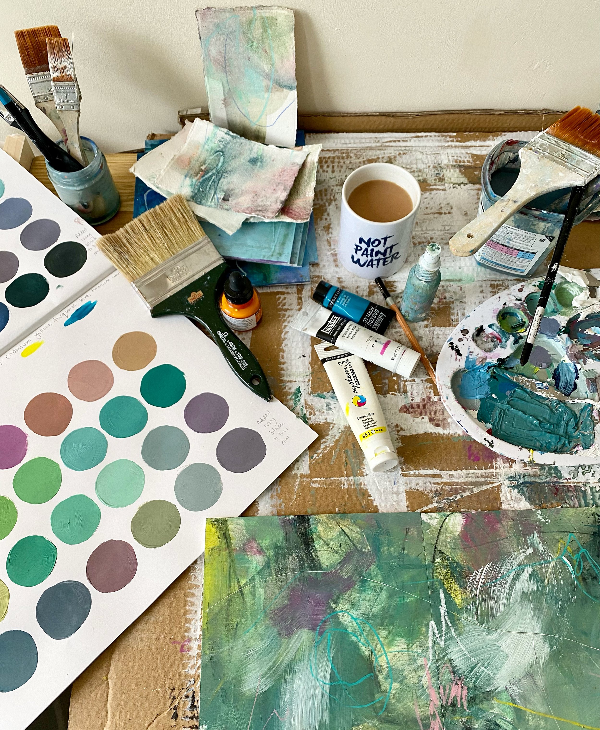 Abstract artist's work station with painting in progress