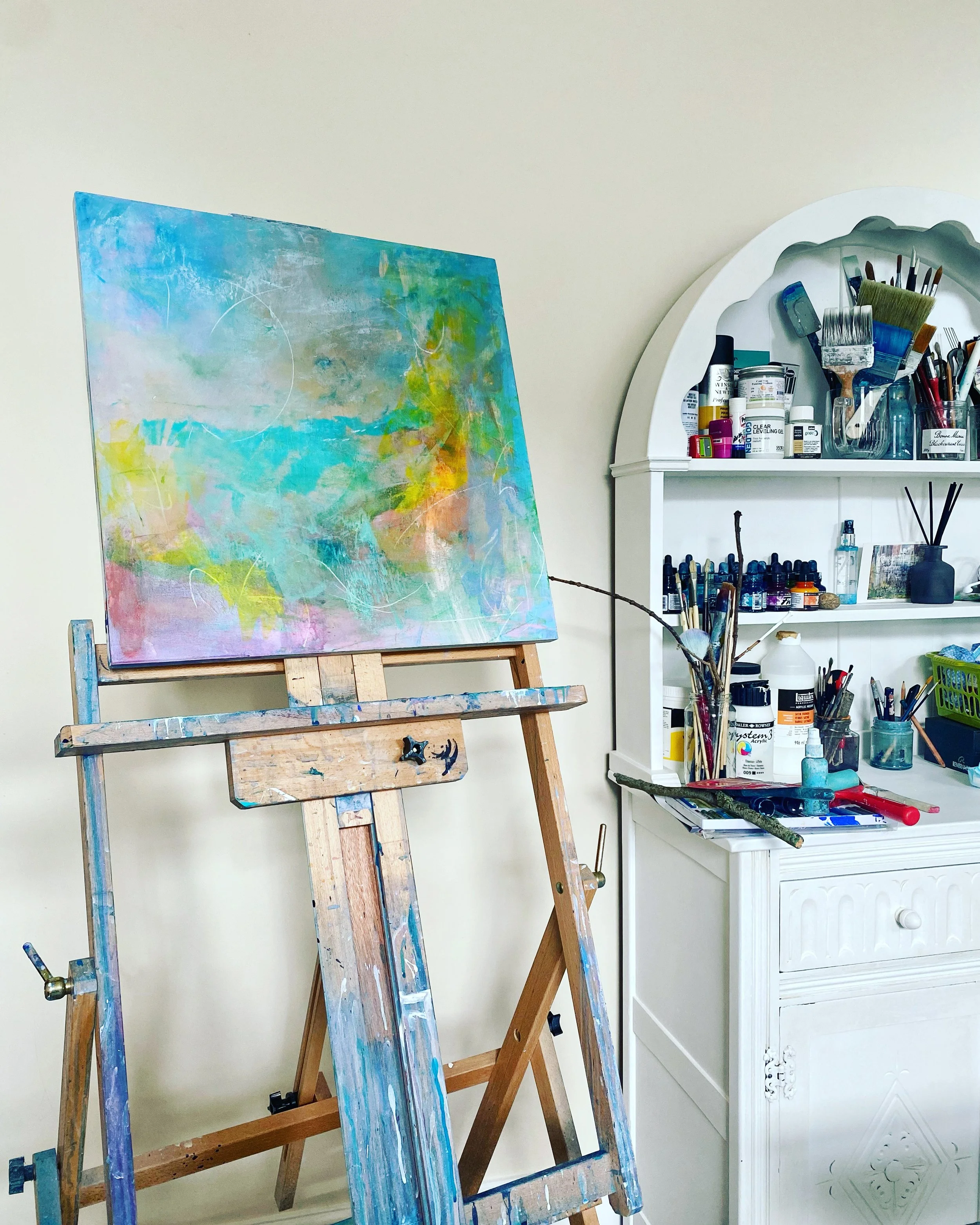 Artist's studio showcasing abstract art on an easel