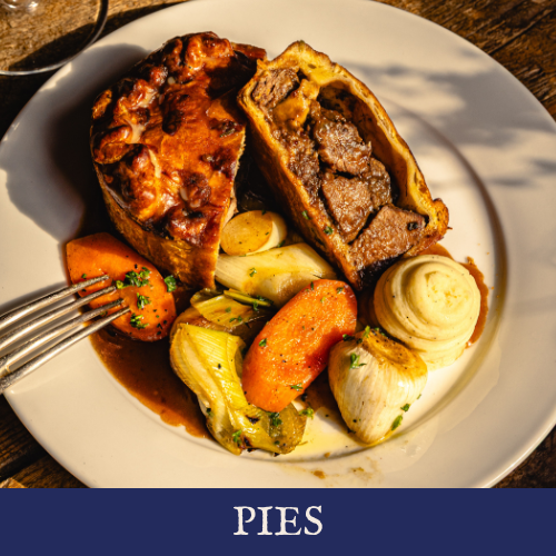 A plate with a slice of meat pie, roasted vegetables including carrots, onions, and celery, and mashed potatoes.
