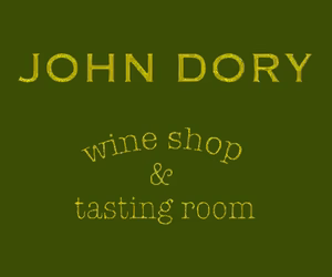 Sign with green background reading 'John Dory' and 'wine shop & tasting room' in yellow text.