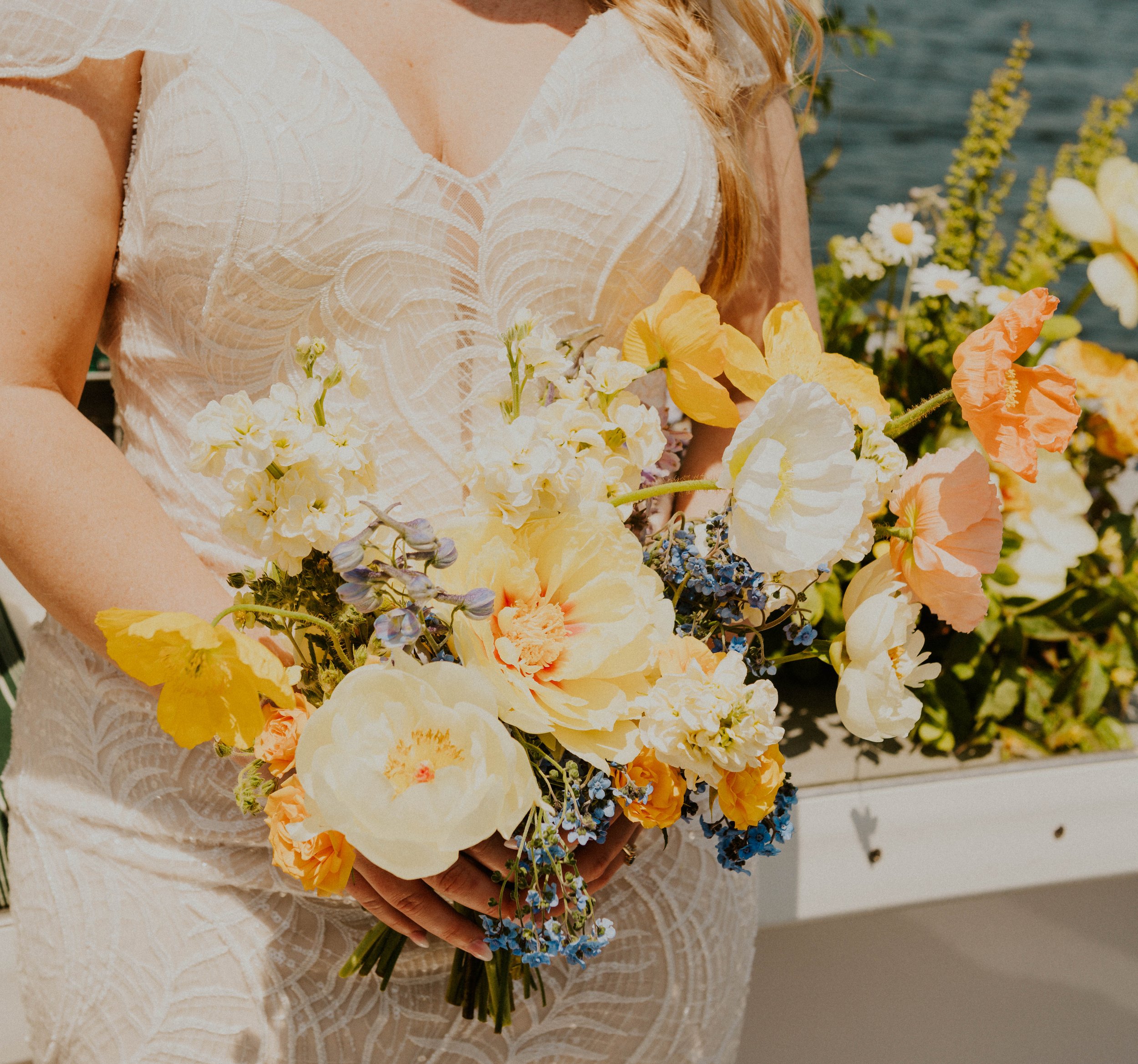 Detail of bridal bouquet with poppies yellow and orange