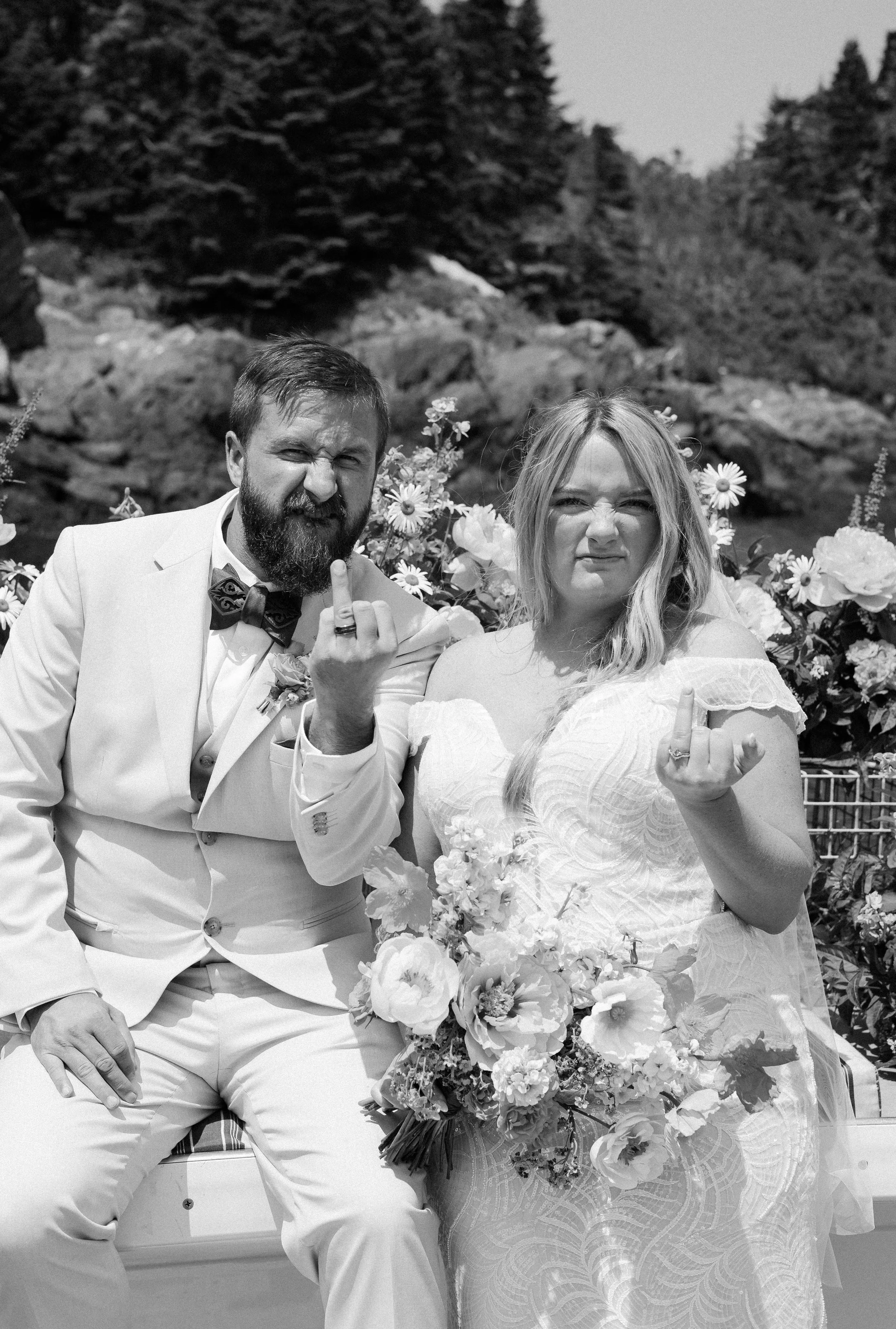 Bride and groom showing us their ring fingers