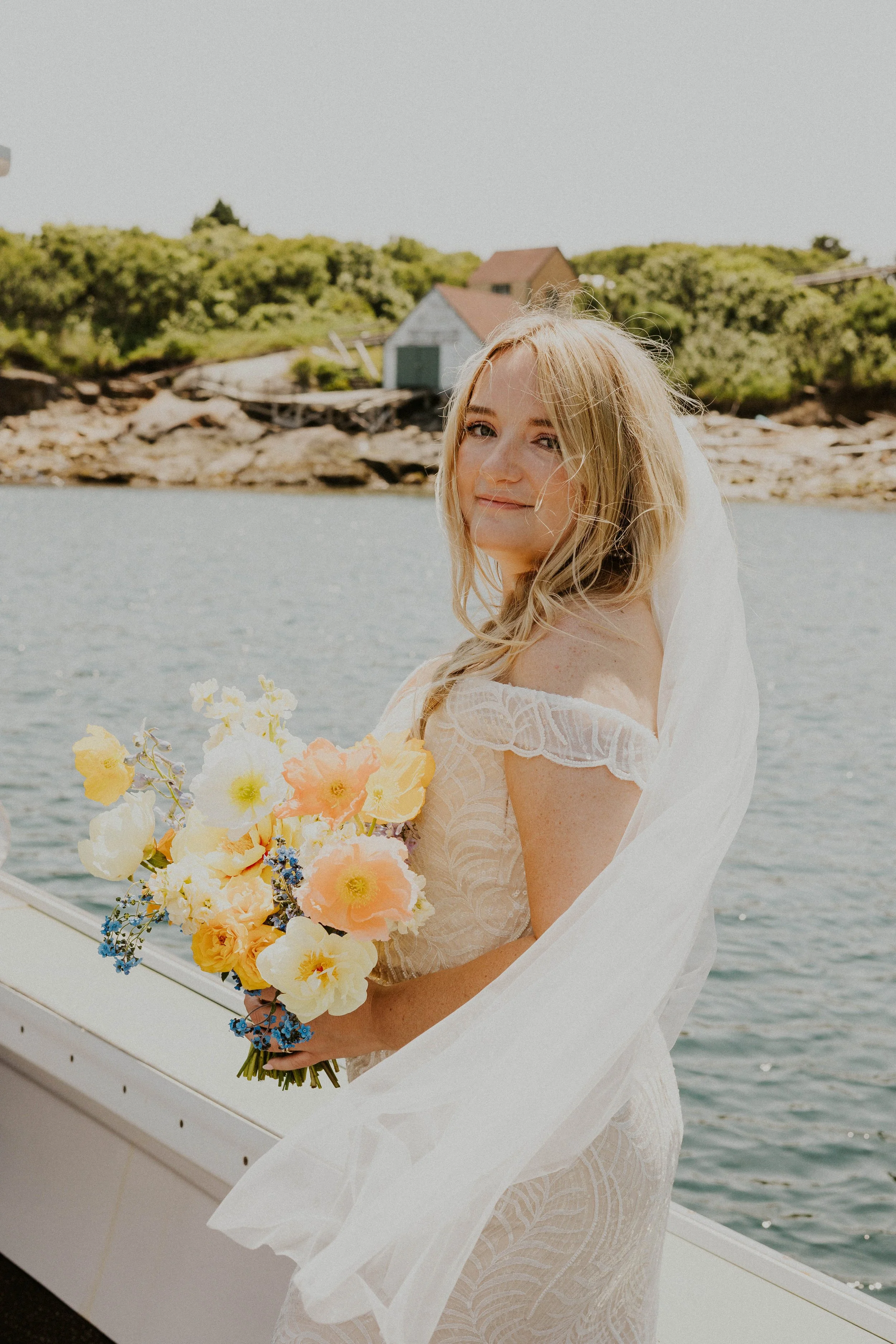 Payton in her veil holding bridal bouquet