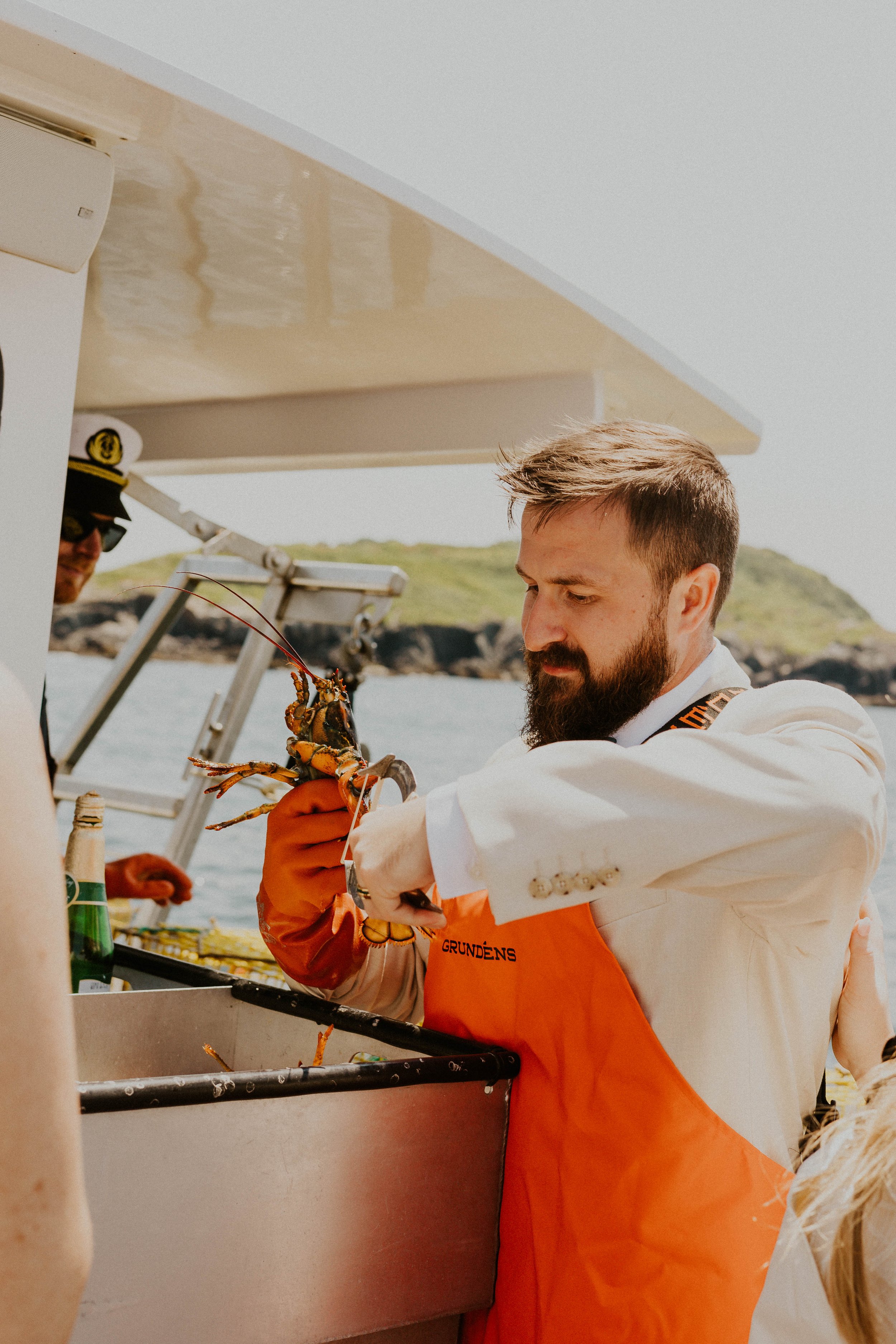 Groom banding lobsters