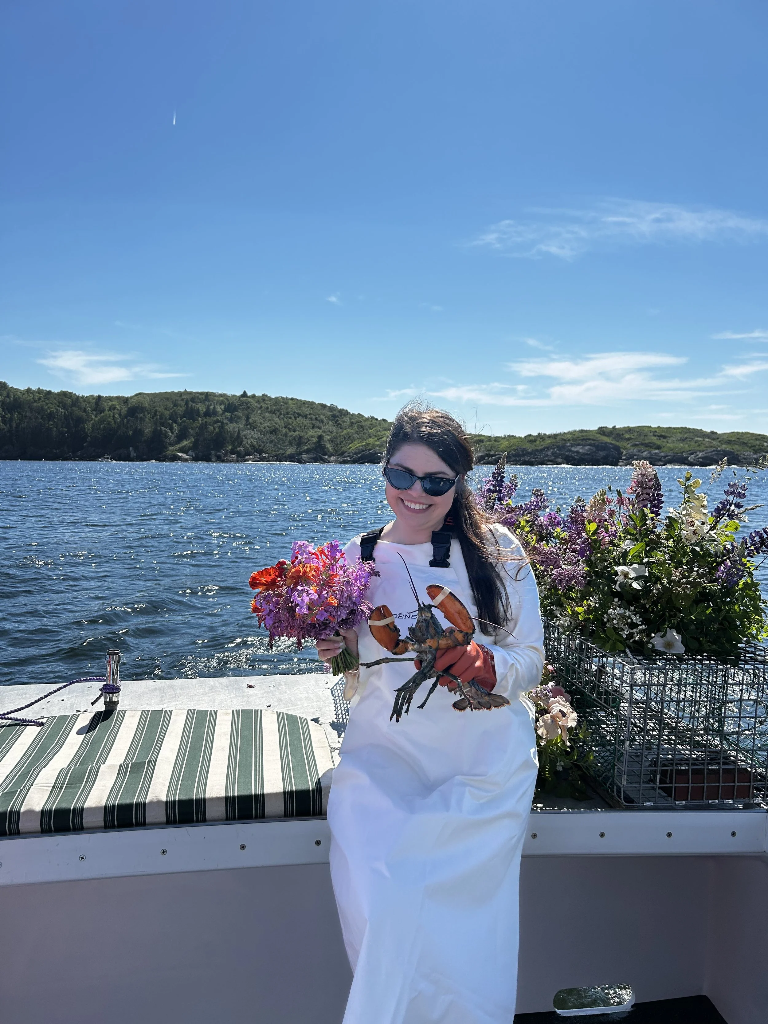 bride holding bouquet on adventurous boat elopement