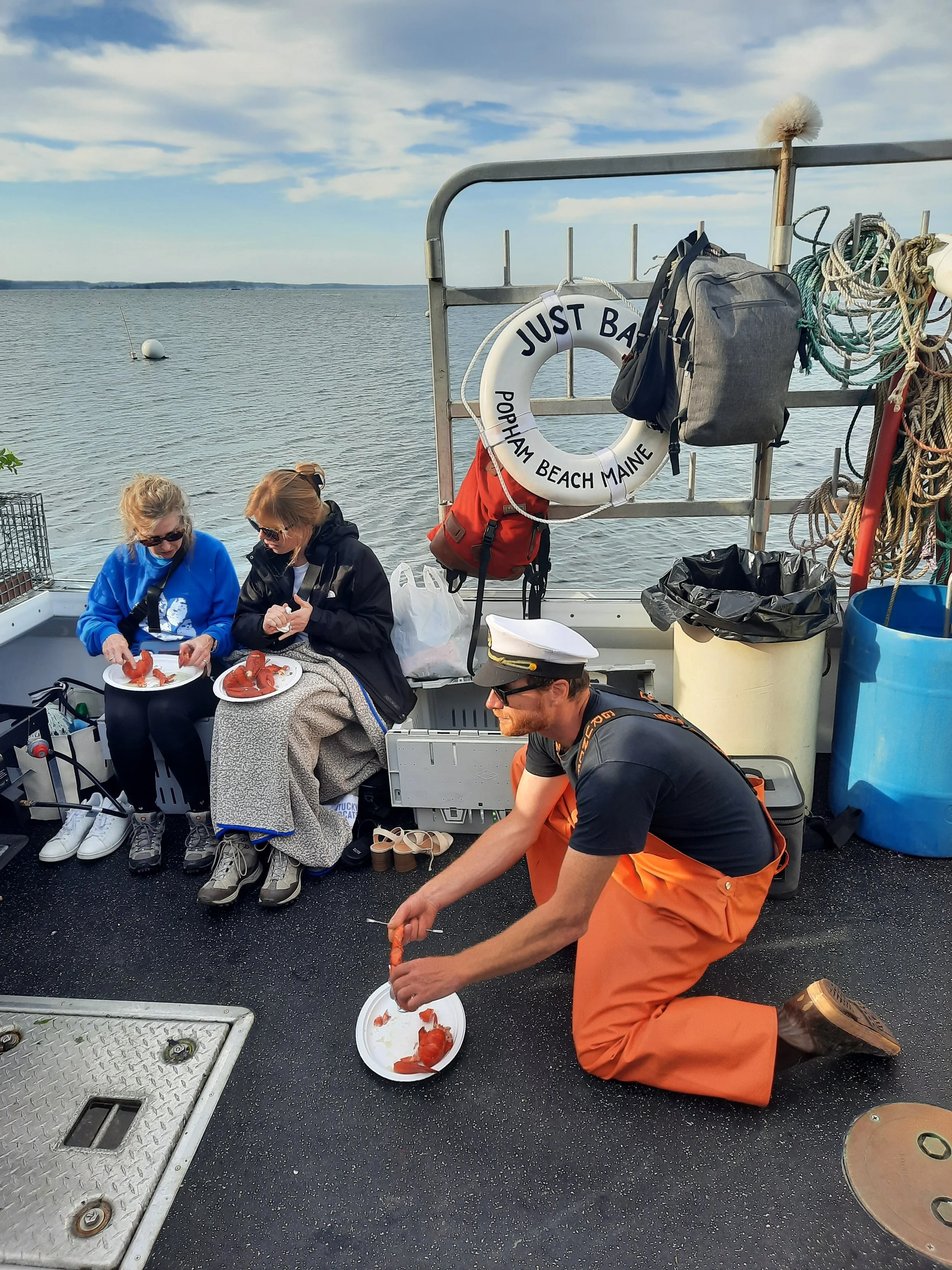 wedding party enjoying the lobster bake at seguin island