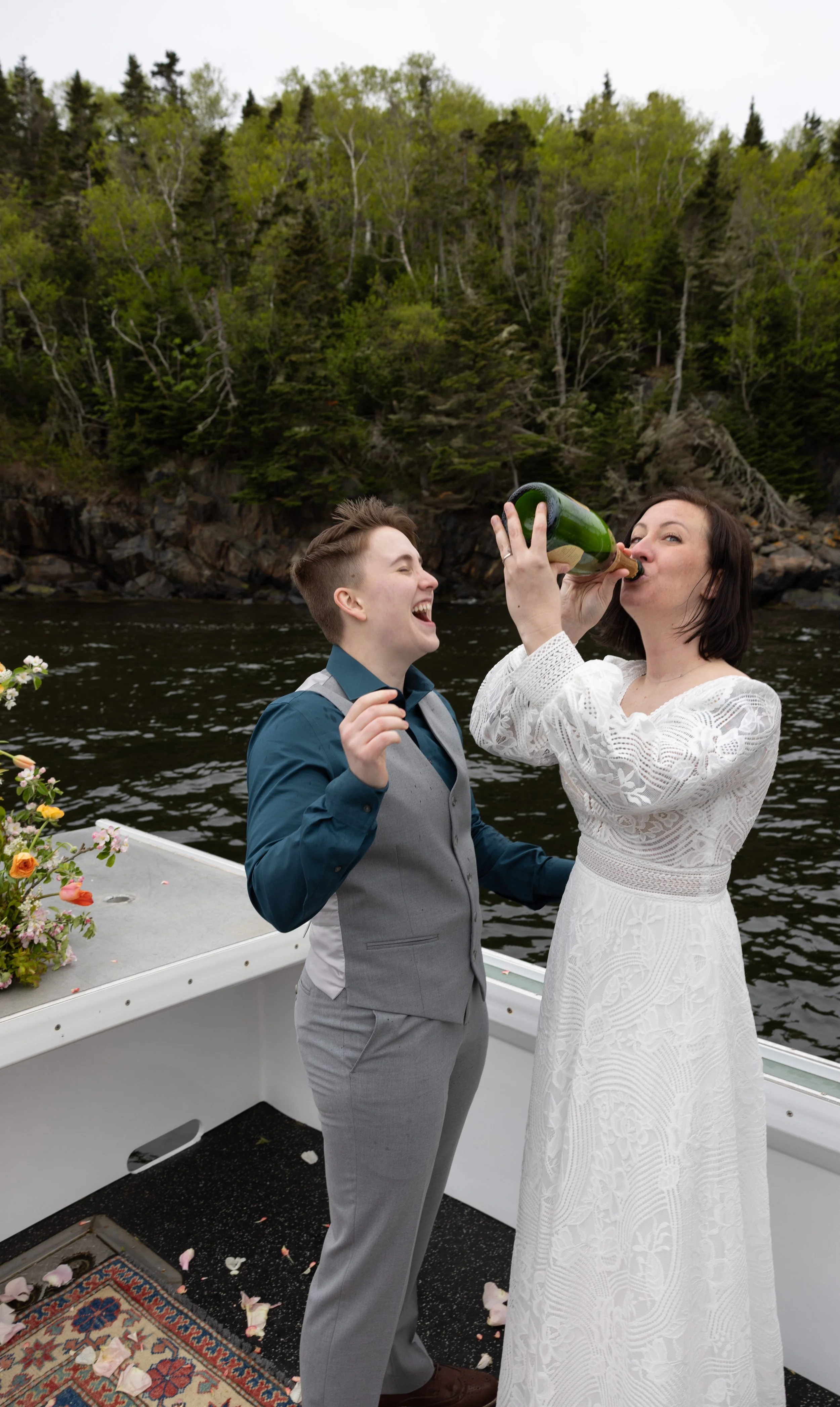 drinking champagne on boat during elopement charter