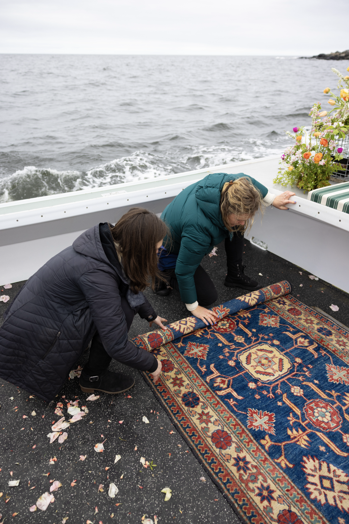 elopement crew putting rug away preparing for hauling