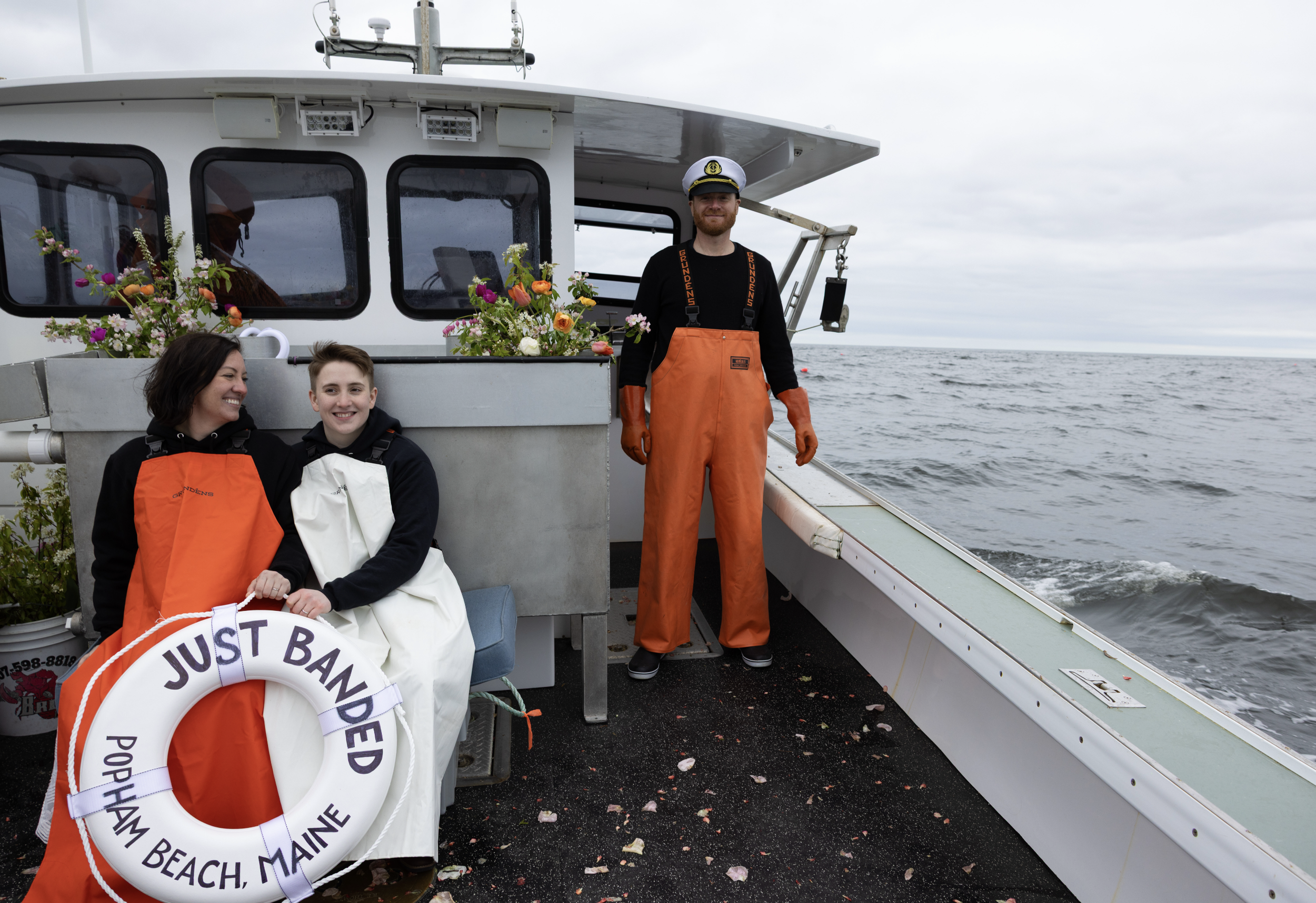 brides getting ready to haul traps after wedding ceremony