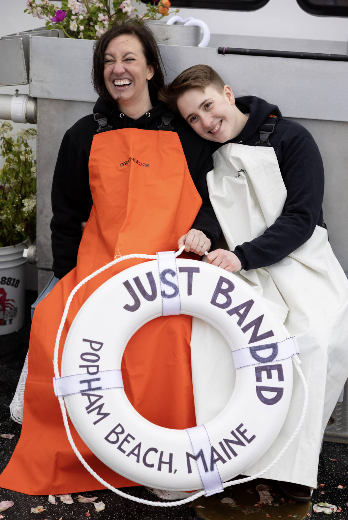 couple in love on lobster boat in maine