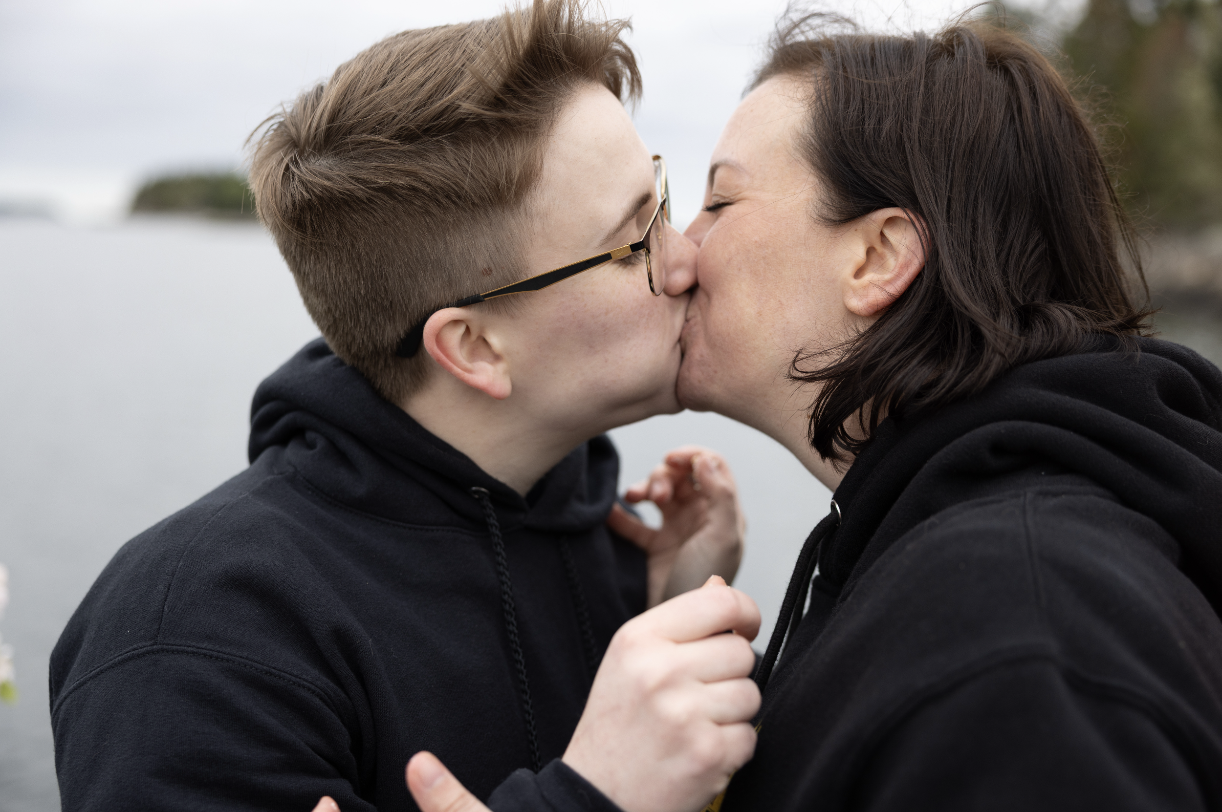 casual cake cutting on boat during coastal Maine adventure elopement