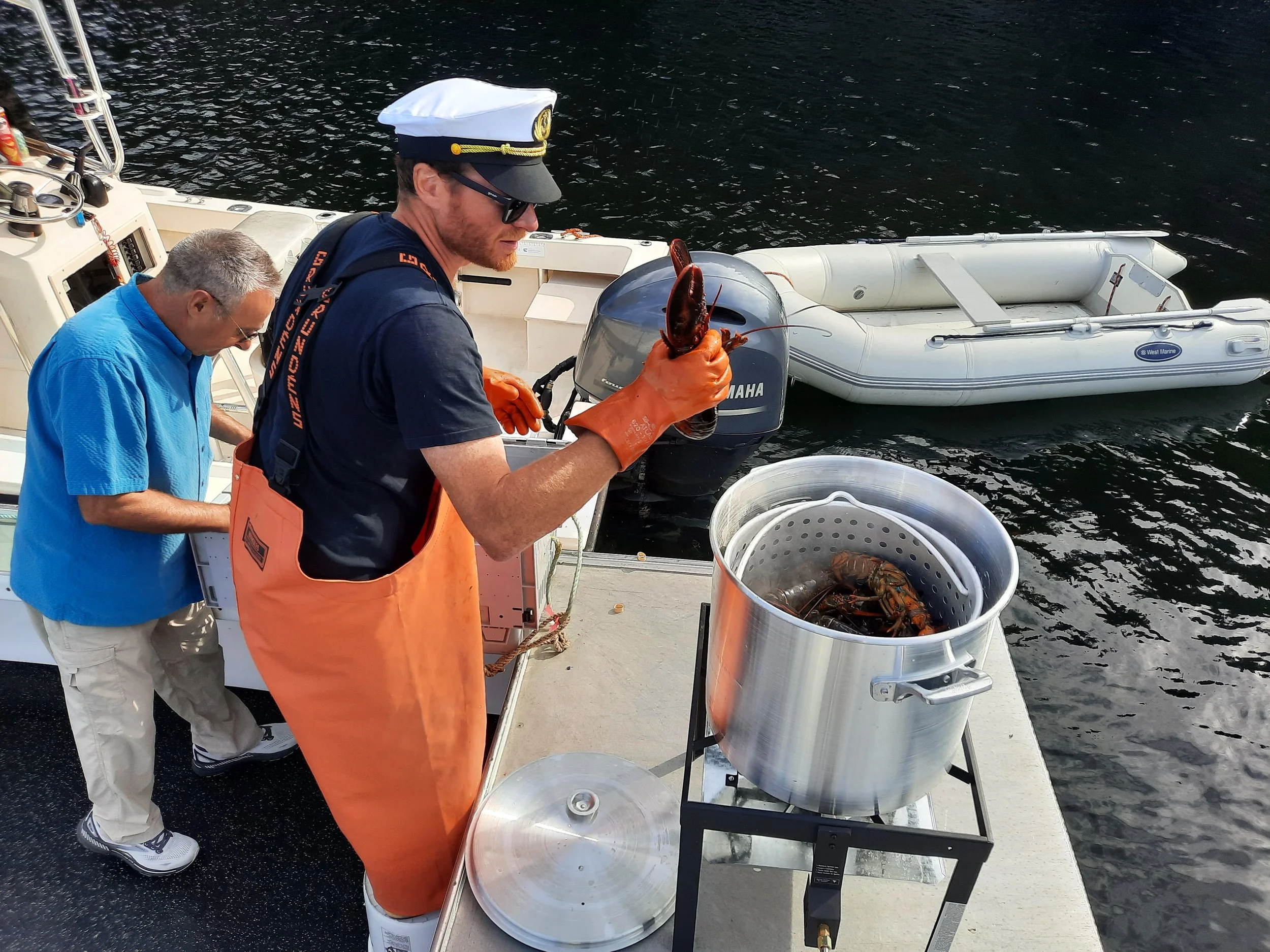 fresh lobster bake prepared on boat for wedding celebration