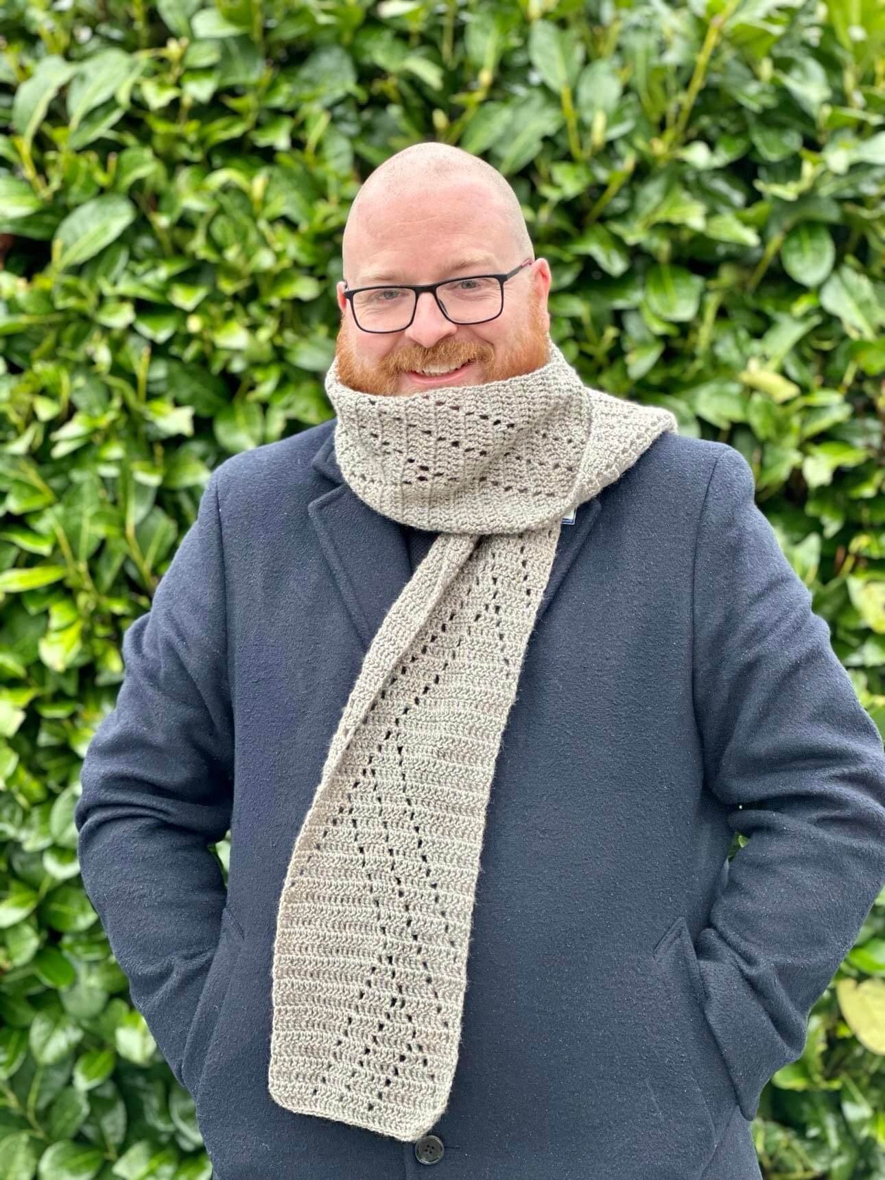 Lee wearing crocheted mytikas scarf outside of coat tiny.jpg