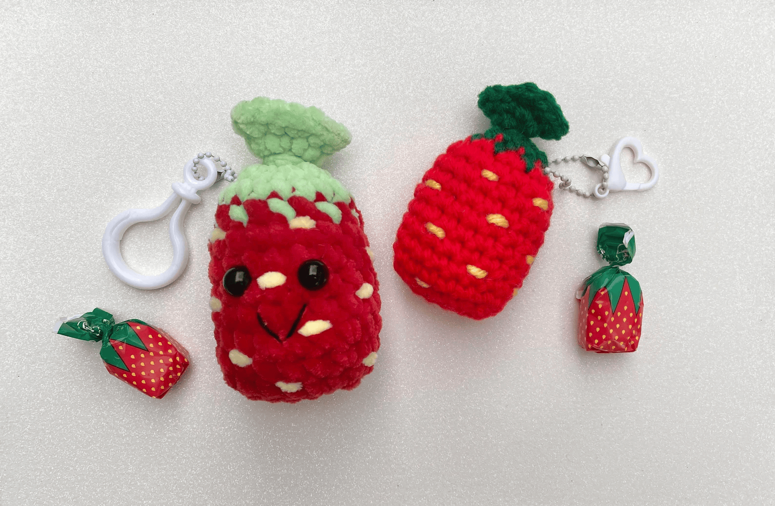 strawberry keychain, clickety sticks yarn png.png