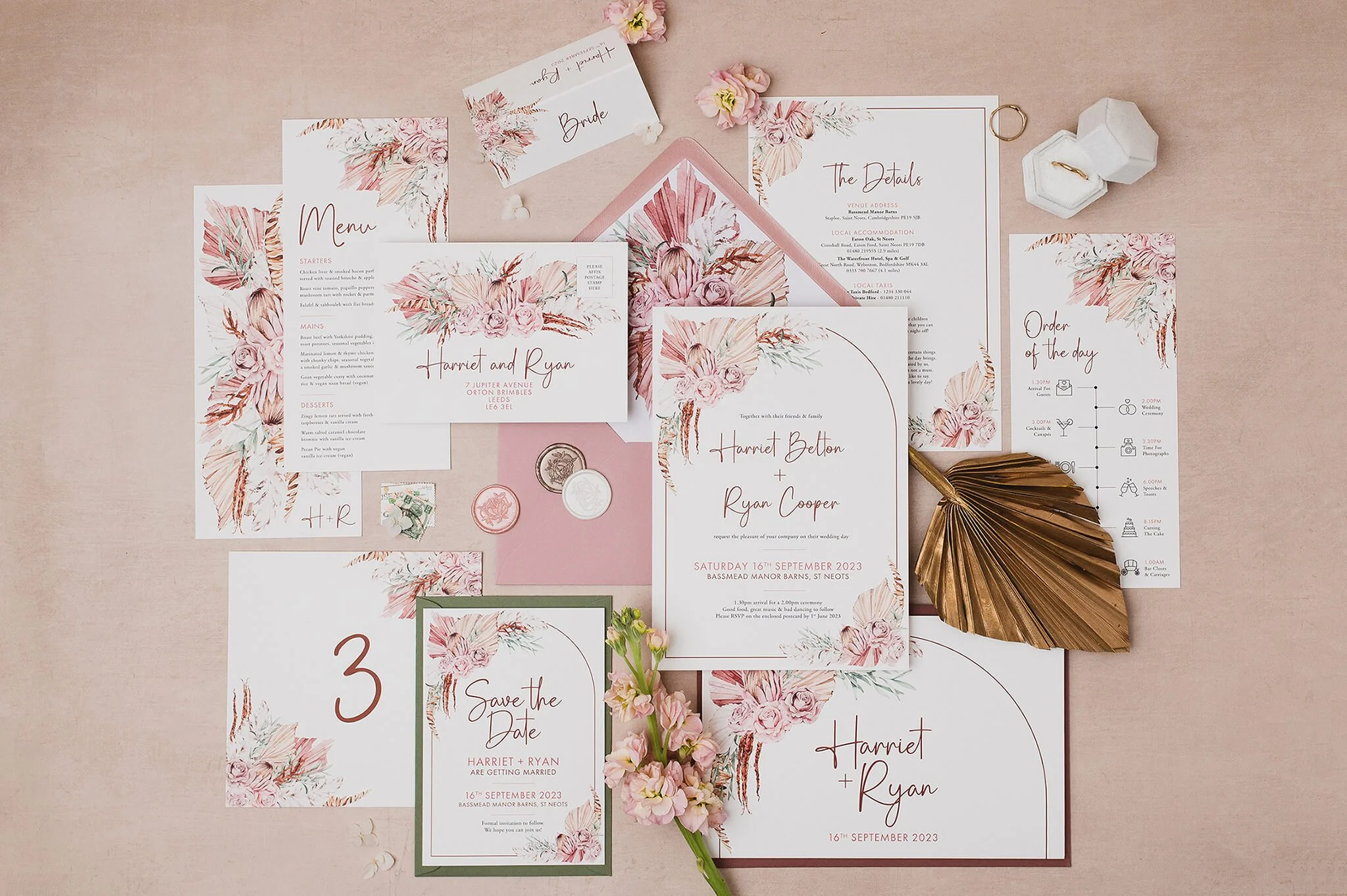 Boho dusty pink wedding invitations and stationery set including save the date, RSVP, menu, and place cards featuring floral watercolour design in rose pink and sage green tones, arranged on a beige background.