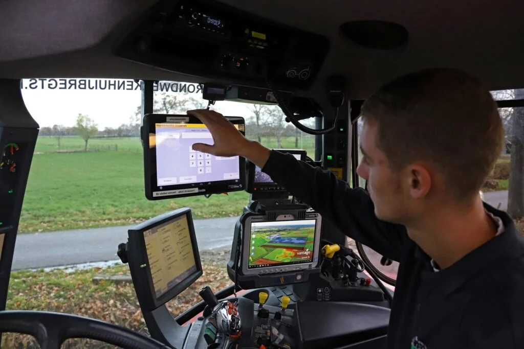 Successful farmer using Veris scanner in the cab of tractor