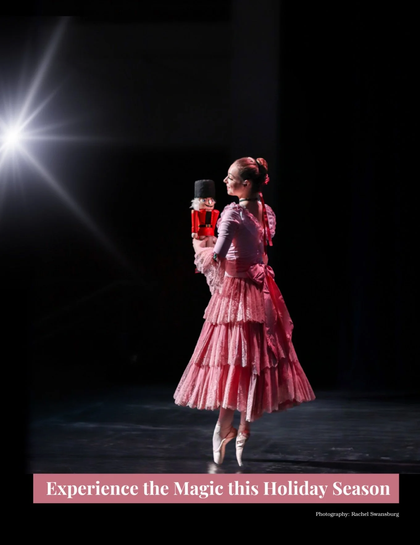 Clara holding the Nutcracker in doll form on stage in Fall River, Massachusetts