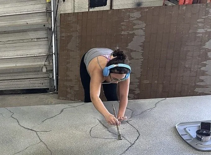 aubrey painting urinetown ramp.webp