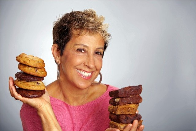 Judy holding up her baked goods