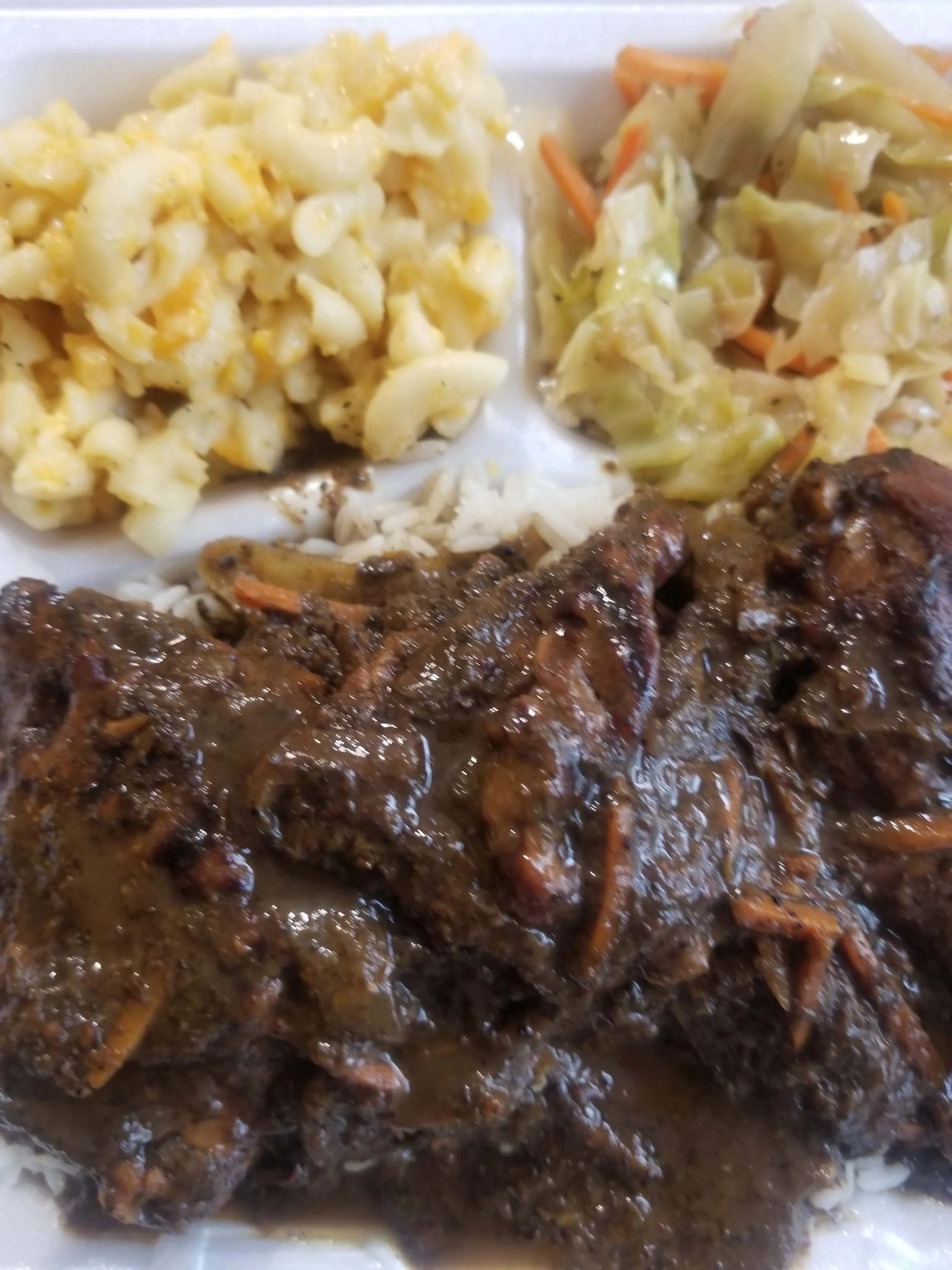 Jerk Chicken with mac and cabbage.jpg