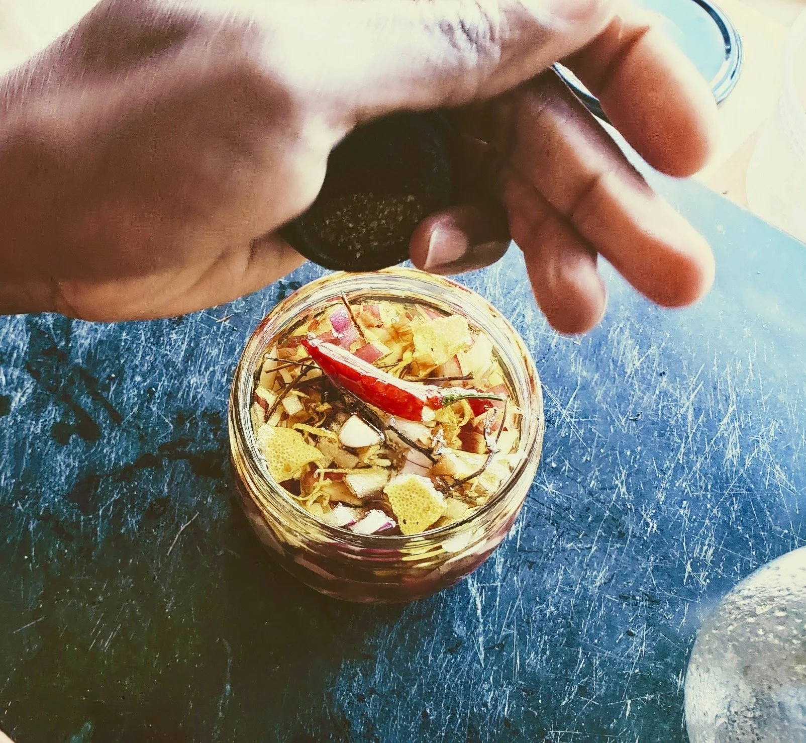 red onions, peppers, lemon peel, thyme, in rice wine vinegar and olive oil