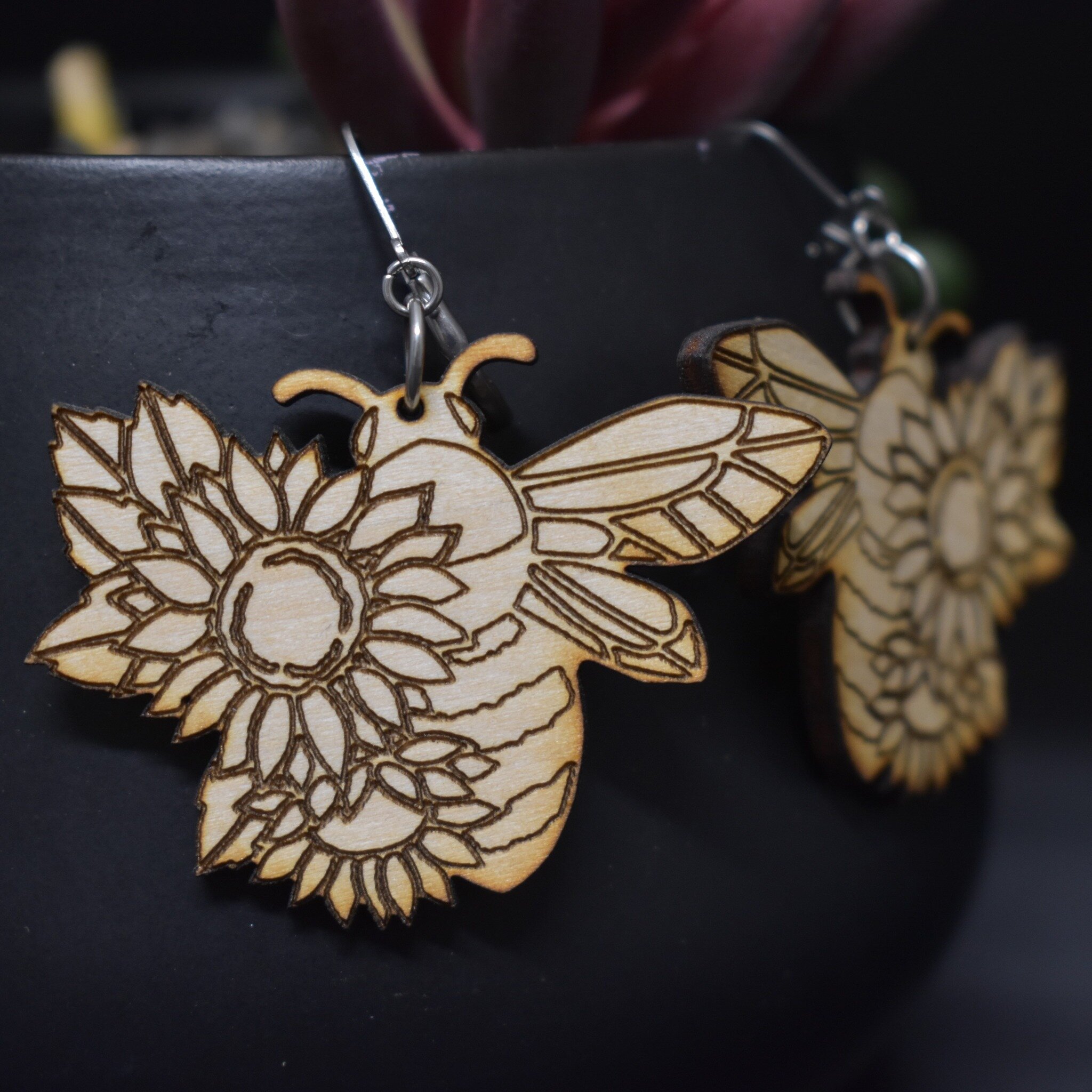 I have 3 pairs of these floral bee earrings in stock and ready to ship. #woodenearringsforsale #woodearringset #woodearringsforsale #beeearring #beeflowers #floralbee #floralbeedesign #momownedcompany #shoplocalcoloradobusiness #coloradosmallbusiness
