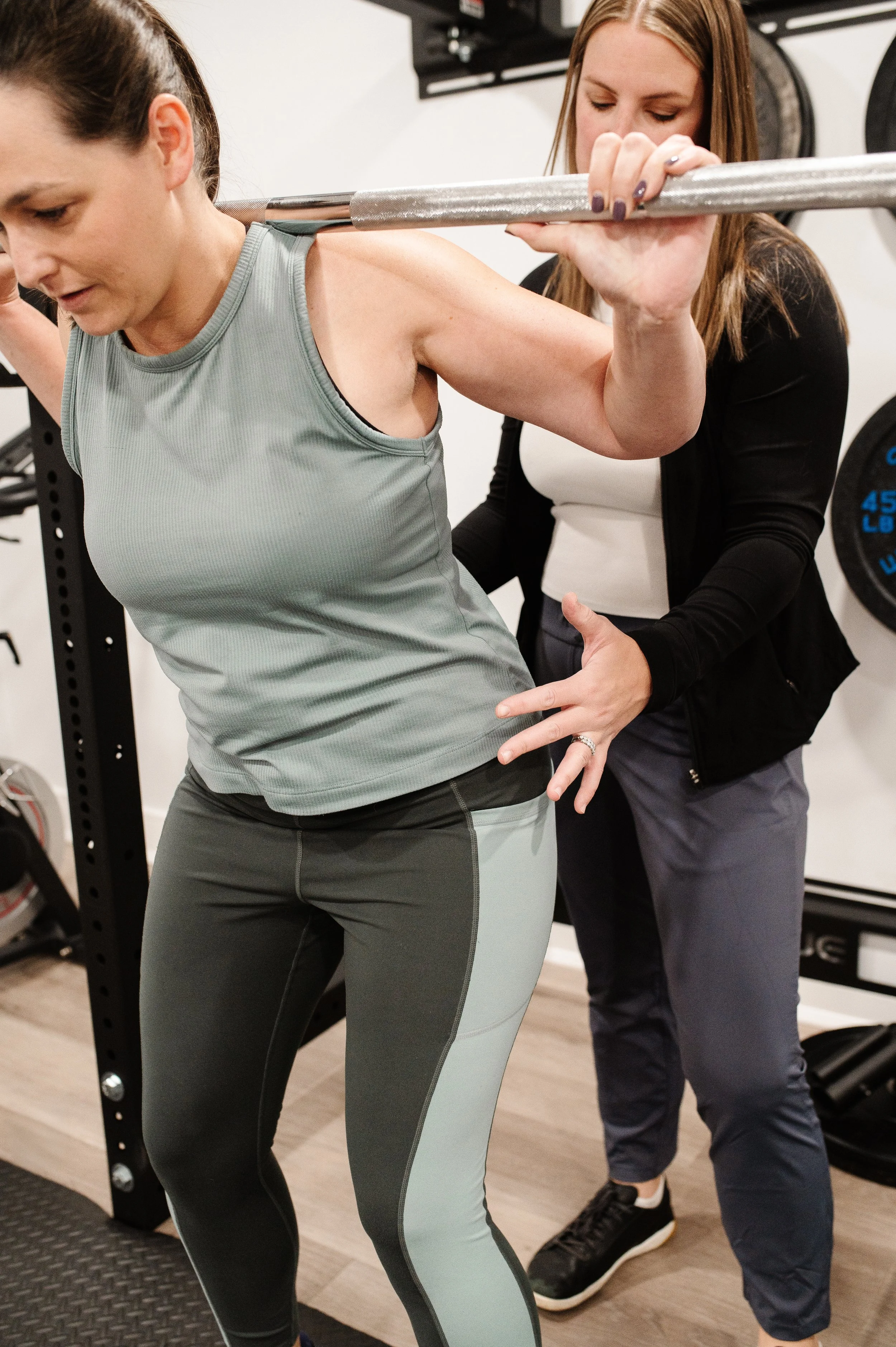 A patient performing pelvic floor physical therapy exercises in pelvic floor therapy using a barbell in our pelvic floor PT clinic in Newtown, PA.