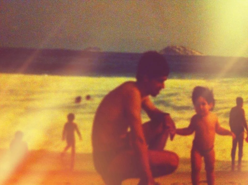 Julia Carter with her father and founder of Brazil Nuts Tours, Adam Carter, at Ipanema Beach in Rio de Janeiro circa 1987
