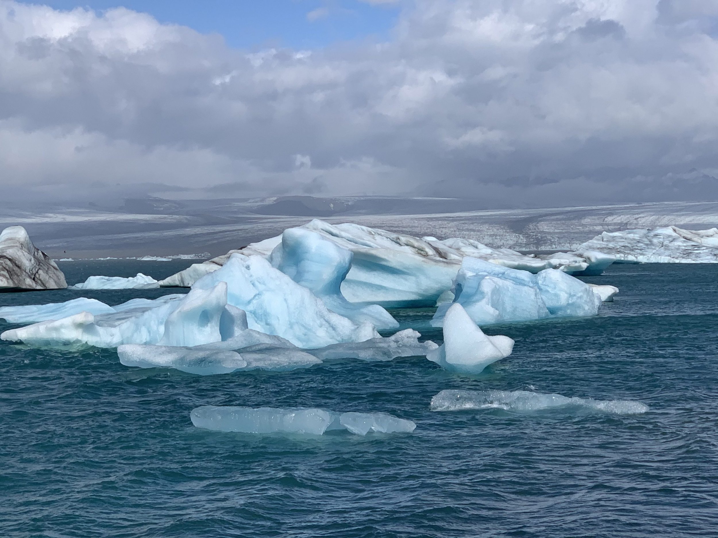 glacial-lagoon-with-icebergs-floating-around-1-scaled.jpg