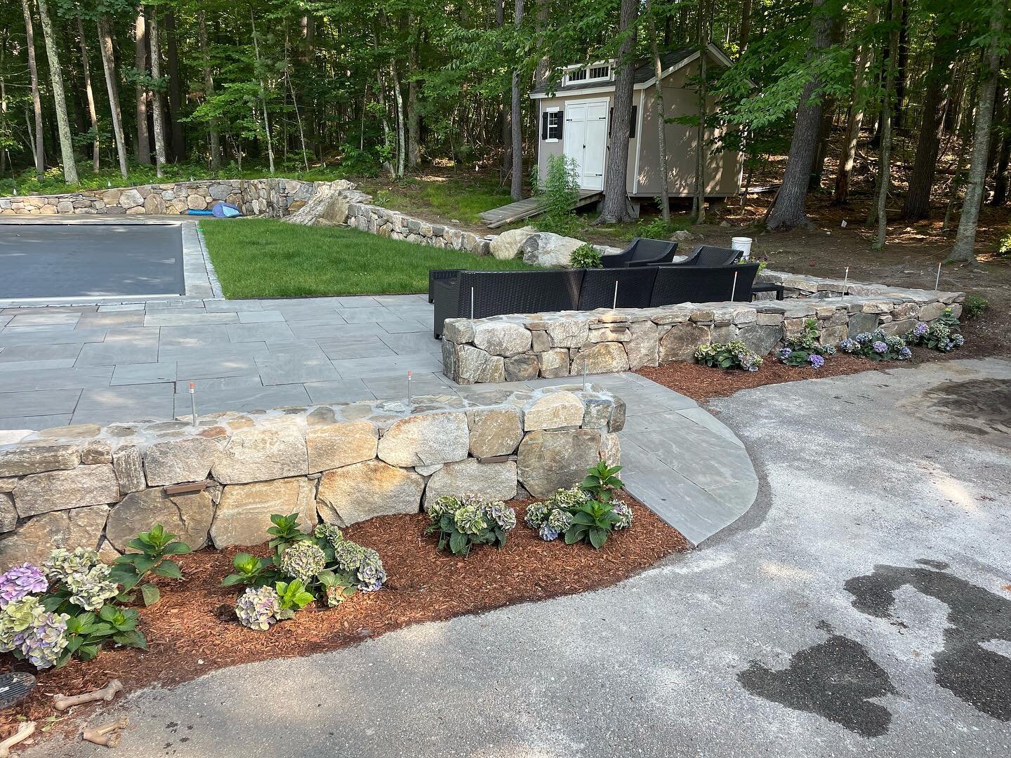 2nd phase of this project done built a privacy wall and completed patio. Fence to be installed on the top. #stonework #mason