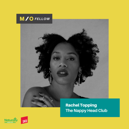Black and white portrait of Rachel Topping with natural curly hair, earrings, and makeup, on a yellow background with teal and black text, promoting her as a fellow of the Nappy Head Club.