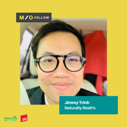 Close-up of a man with glasses smiling, with a yellow background and text indicating he is Jimmy Trinh, a M/O Fellow at Naturally Noah's, with logos for Naturally Austin and SKU.