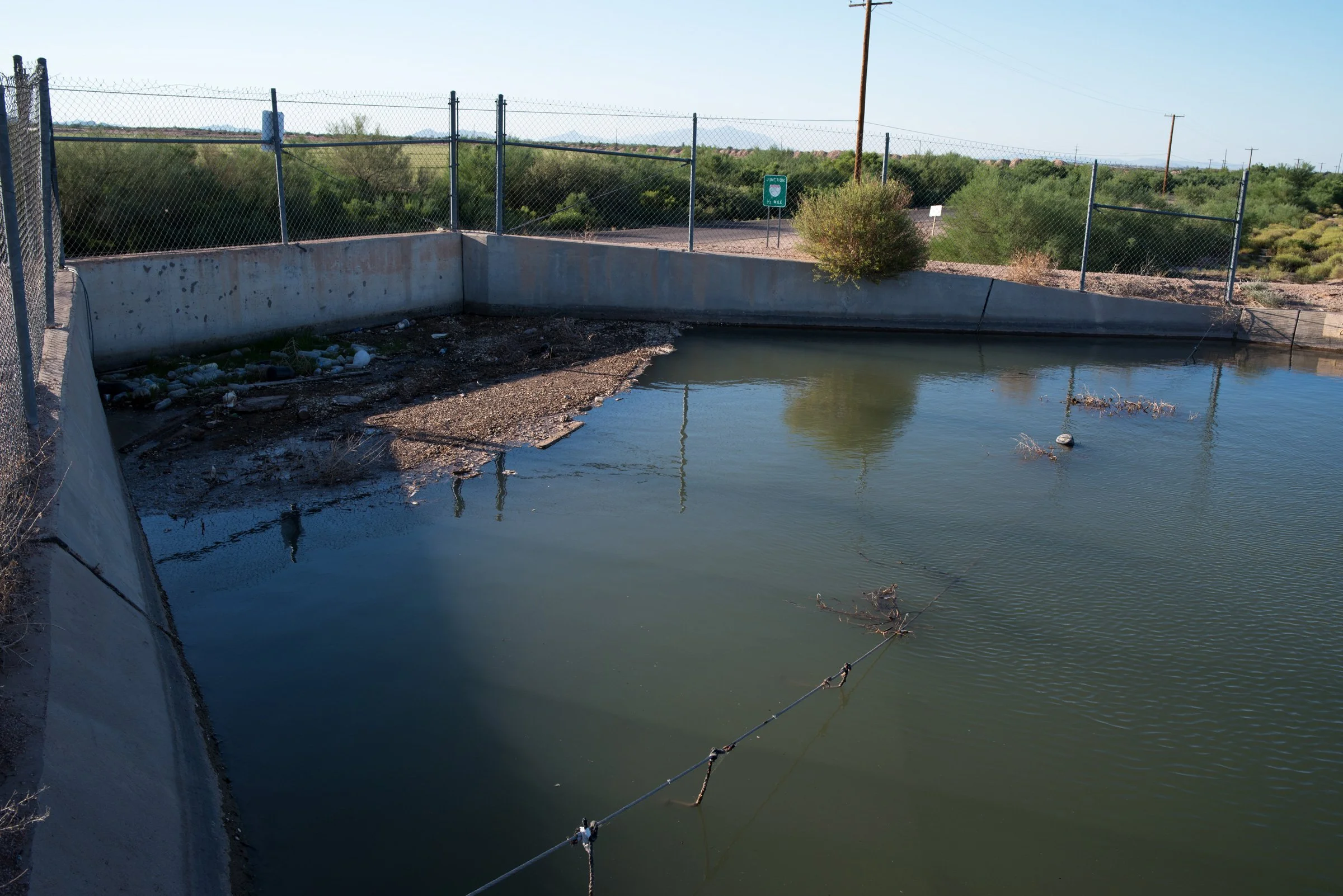 Migrants often seek relief from dehydration along the canals in Casa Grande, south of Phoenix. Here one man, unidentified, was too weak to climb the walls and fell back into the water and drowned. 