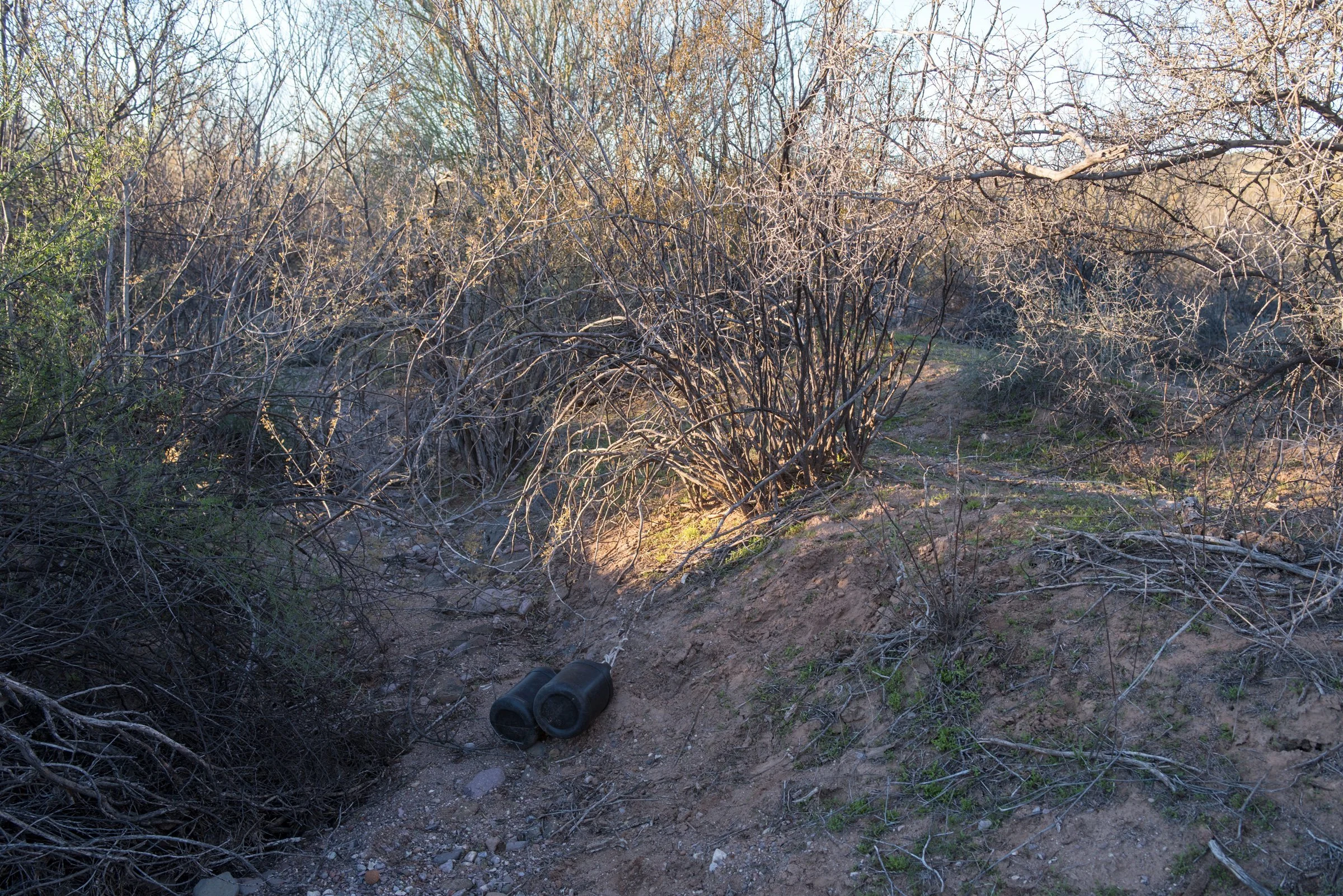  Black water bottles are sold in Mexican border towns. The bottles, which don’t reflect moonlight, are carried by many migrants; and empty bottles are found often in the borderlands. 
