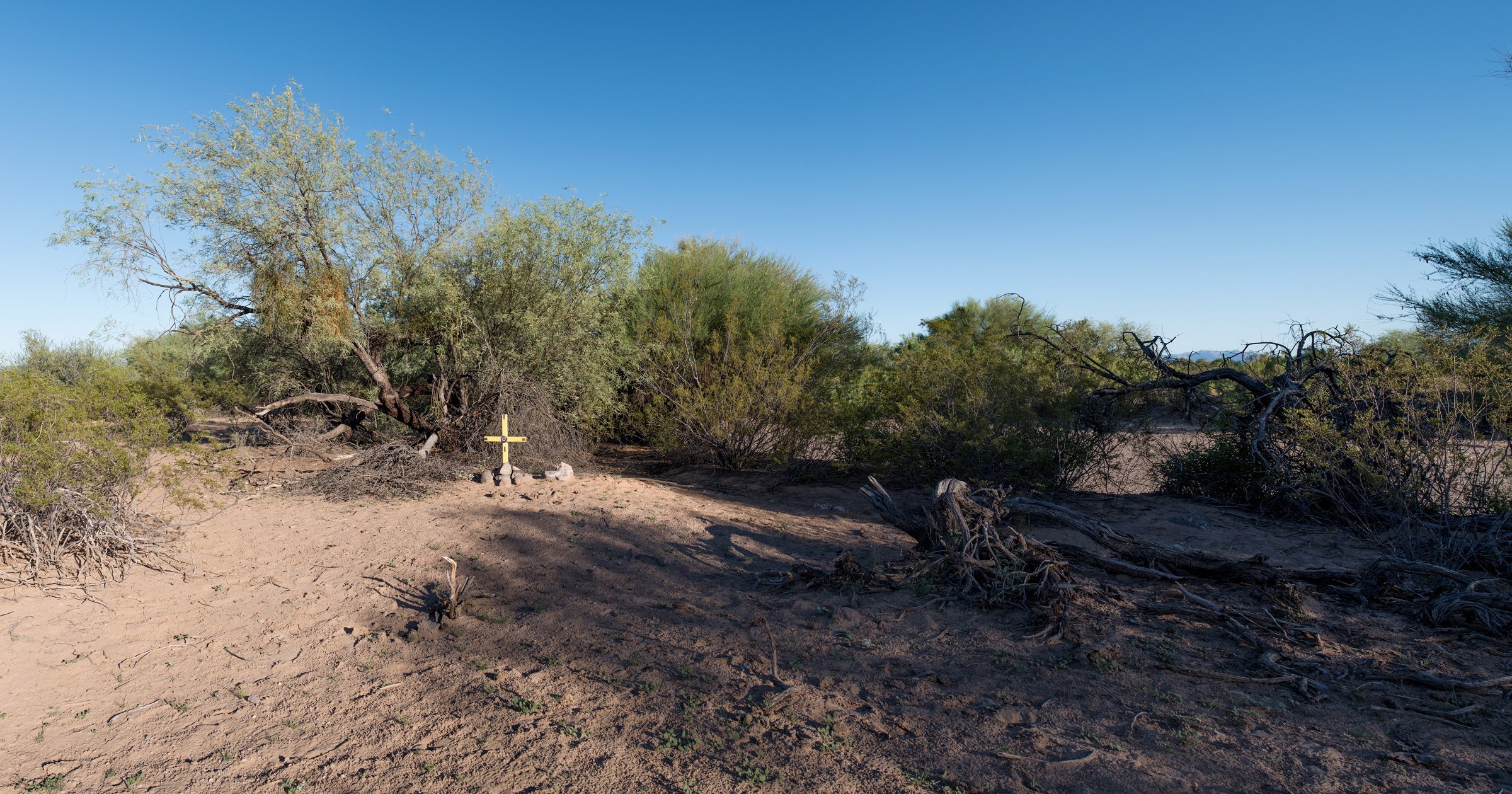  This cross marks the site where an unidentified male migrant died. These makeshift memorials are increasingly common in the southern Arizona desert. 