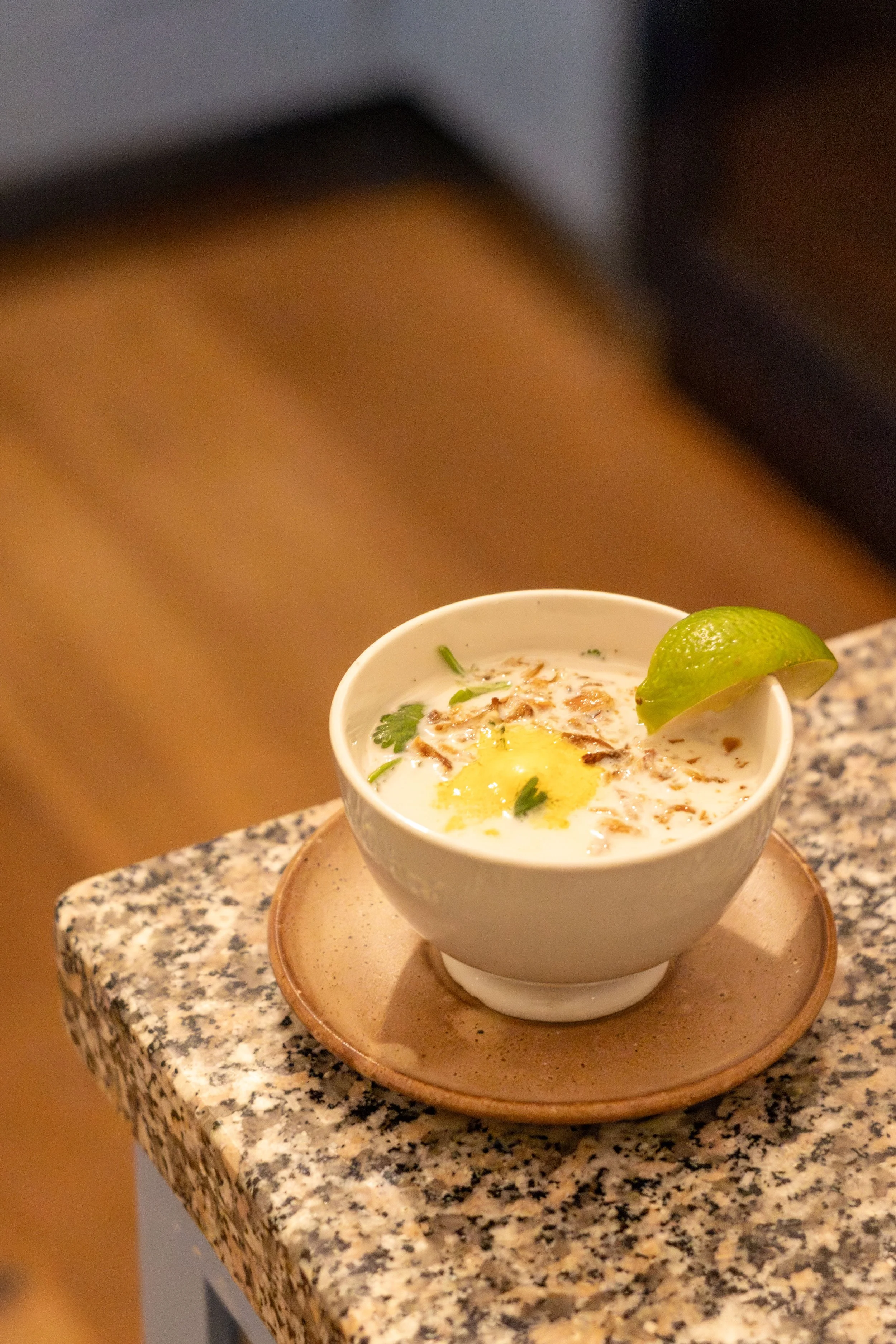 Turmeric melting sphere in coconut soup