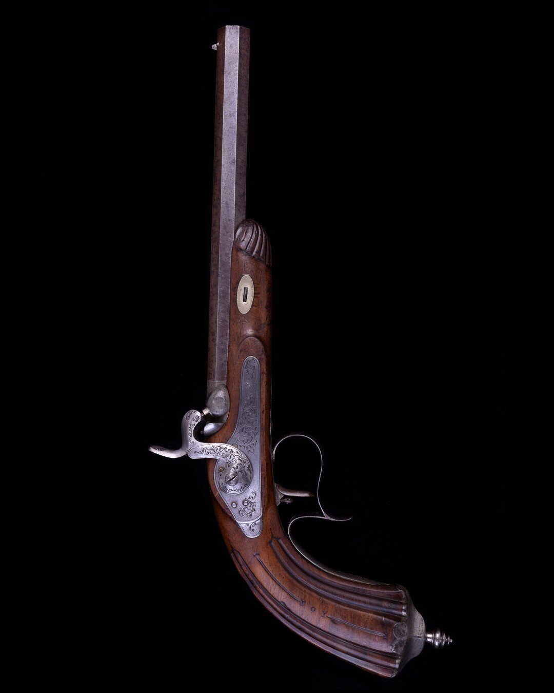 C1850 German Target Pistol &pound;680

A 19th Century ornate Belgian rifled percussion target pistol, probably made for the German market. It has a 24cm twisted, rifled, barrel with Liege ELG proof mark to the side. The engraved spur trigger guard ho