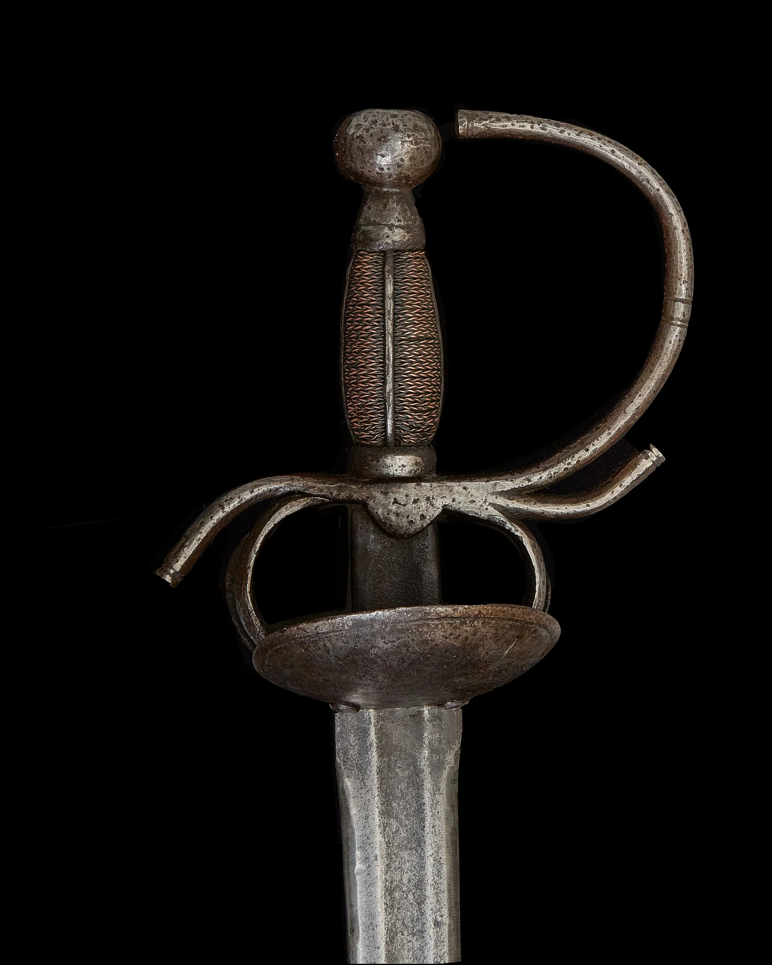 17th century Spanish bilbo copper wrapped handle on black background.jpg.jpg.jpg