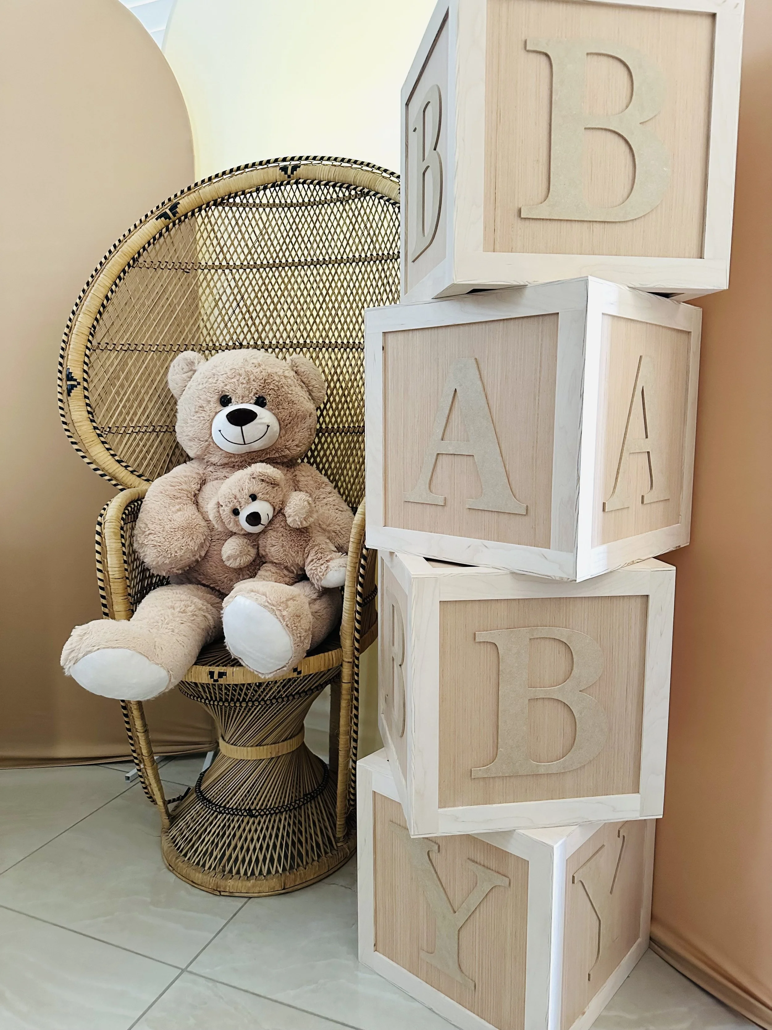Elegant baby shower decoration with 'Bearly Wait' teddy bear display, balloon arch backdrop and decorated pedestals for baby shower party rentals - perfect for gender reveal celebrations
