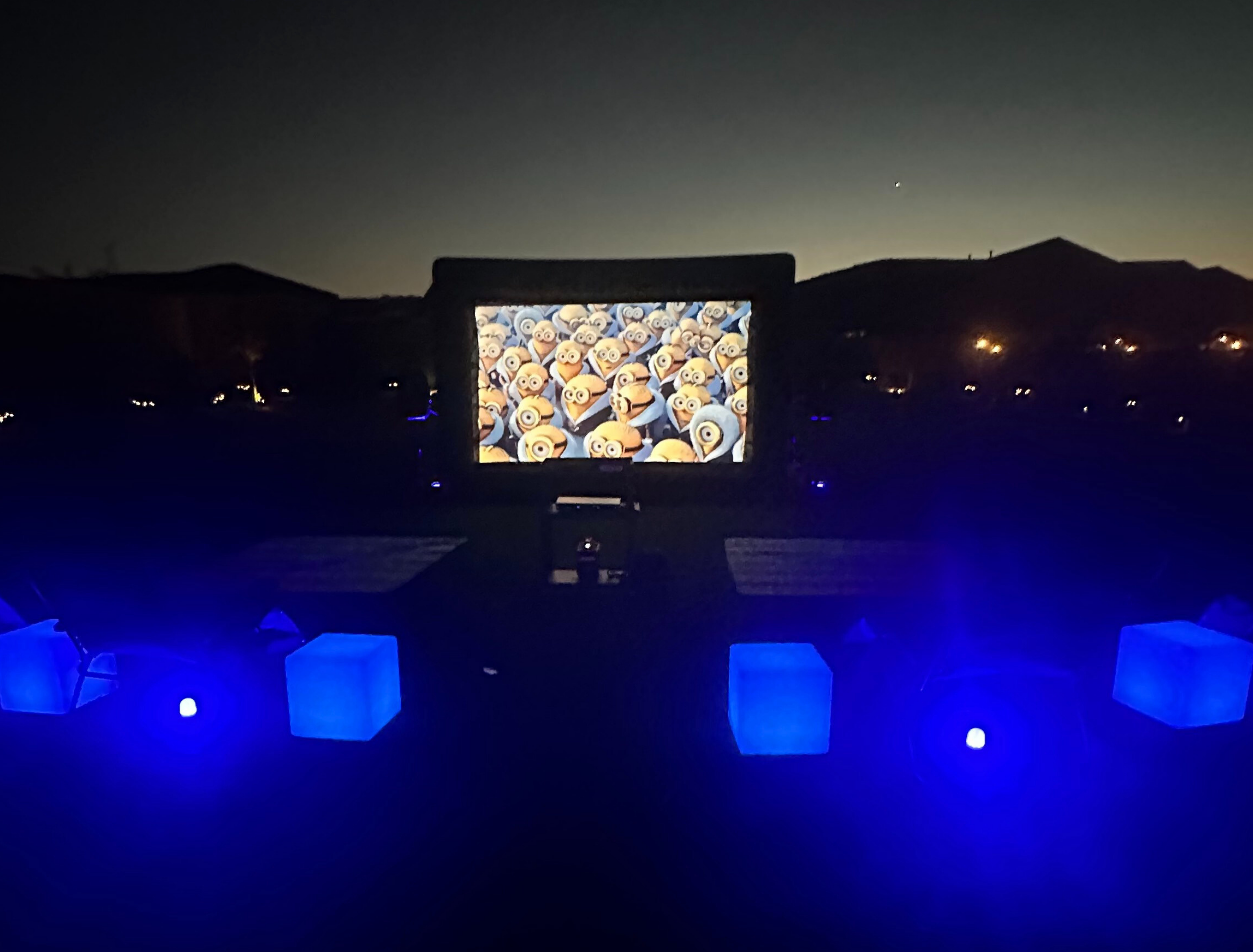 Giant inflatable outdoor movie theatre party rentals with projector and pro audio setup