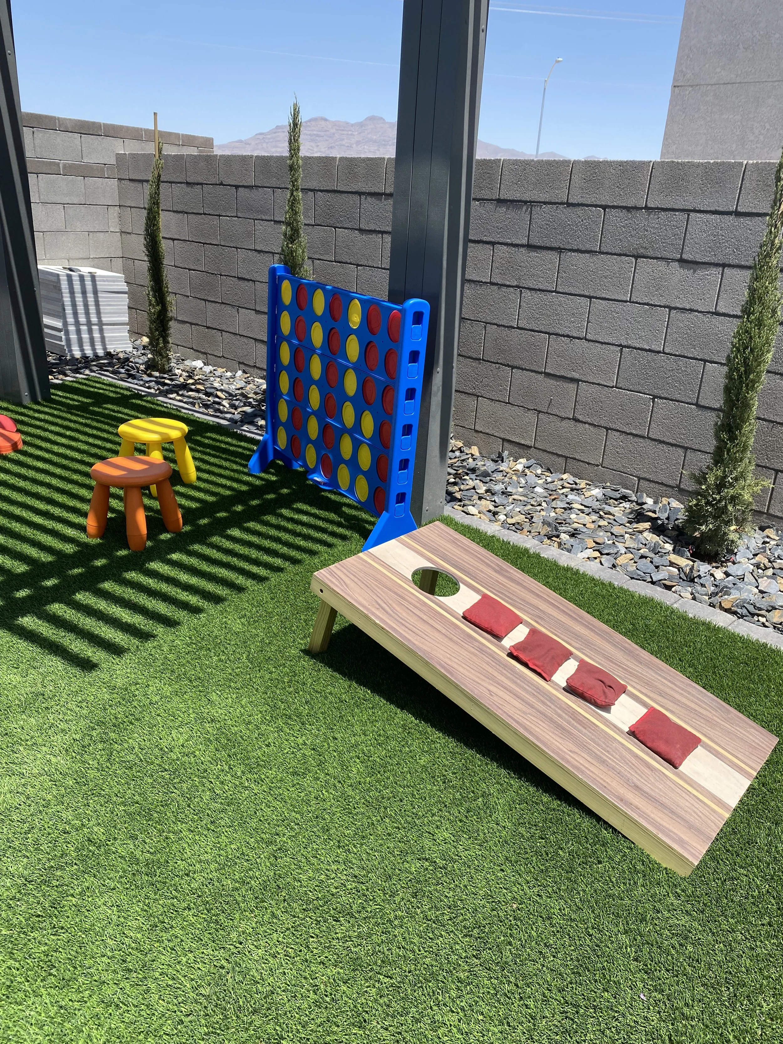 Professional cornhole boards and premium lawn game rentals including oversized giant games available through quality party rentals for backyard celebrations, corporate events, and family gatherings