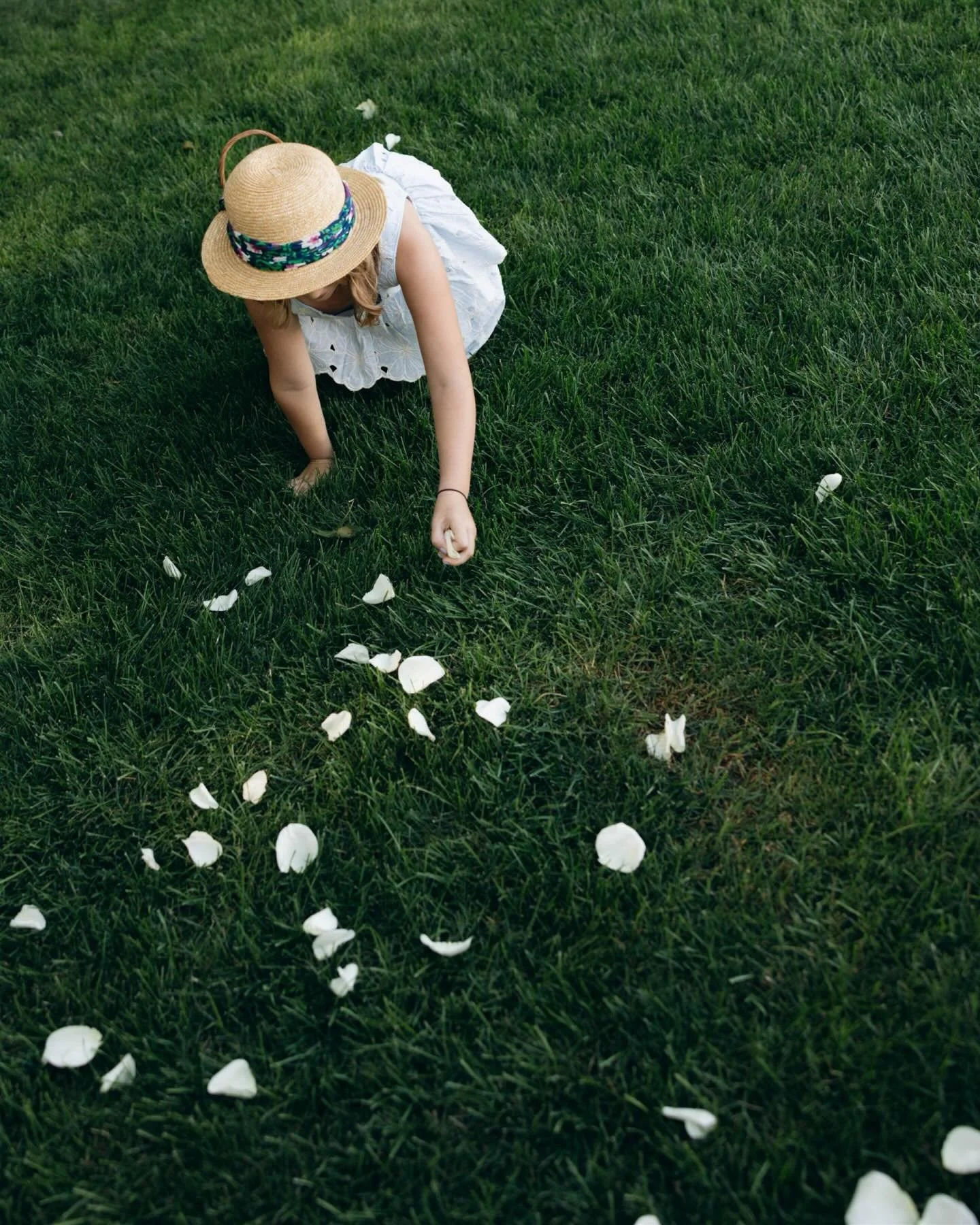 The magic of flower girls just being themselves - with their little hands gathering petals, hiding behind paper fans. In their own world, full of giggles, curiosity. They are always some of my favorite images to come from a wedding gallery. 💫