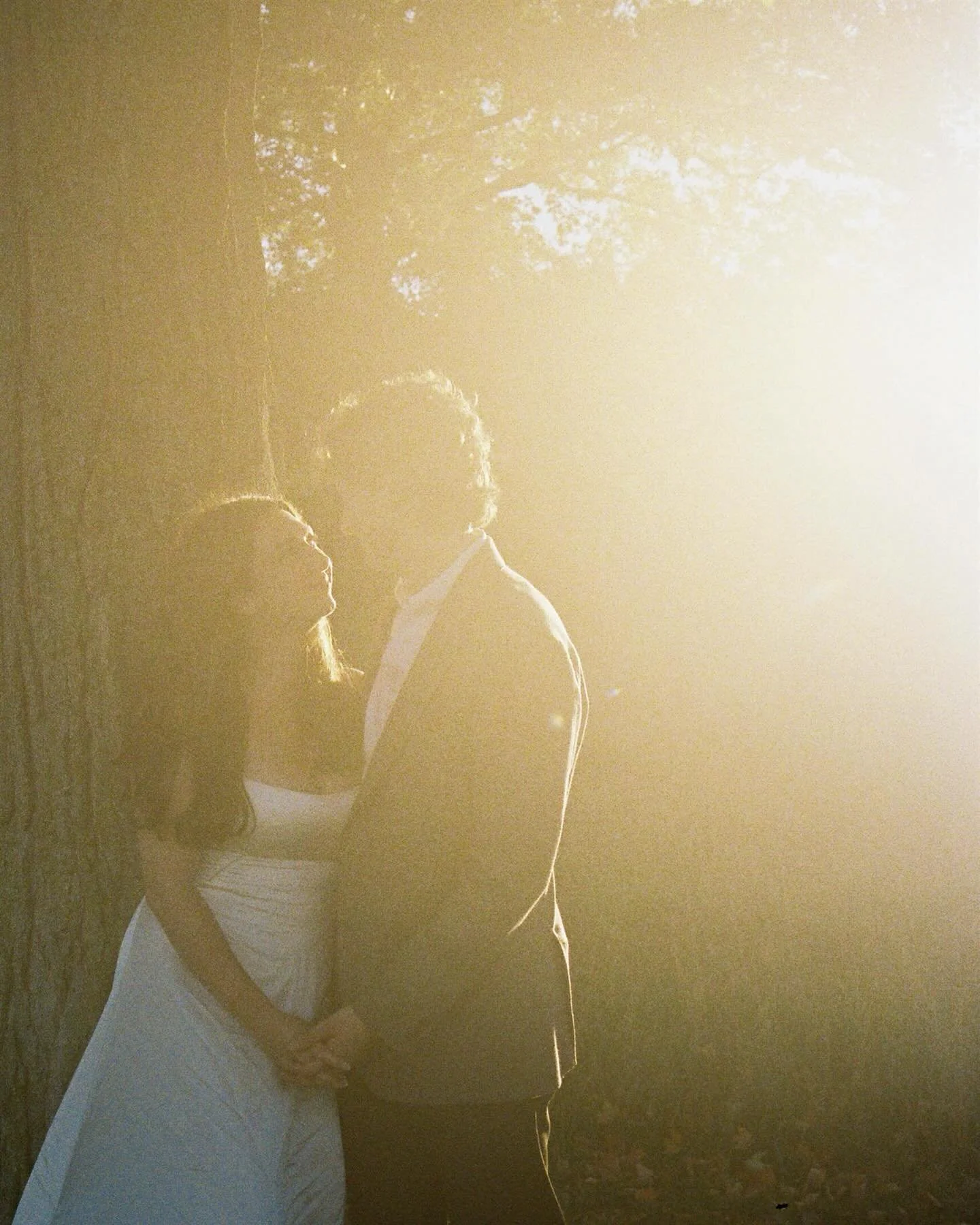 Elise &amp; Vinny in the warm glow of the sunlight&rsquo;s final hour, at Felt Mansion for their engagement session. On Kodak Gold film. 💫 Ready for you 2026 couples!!!!!!
